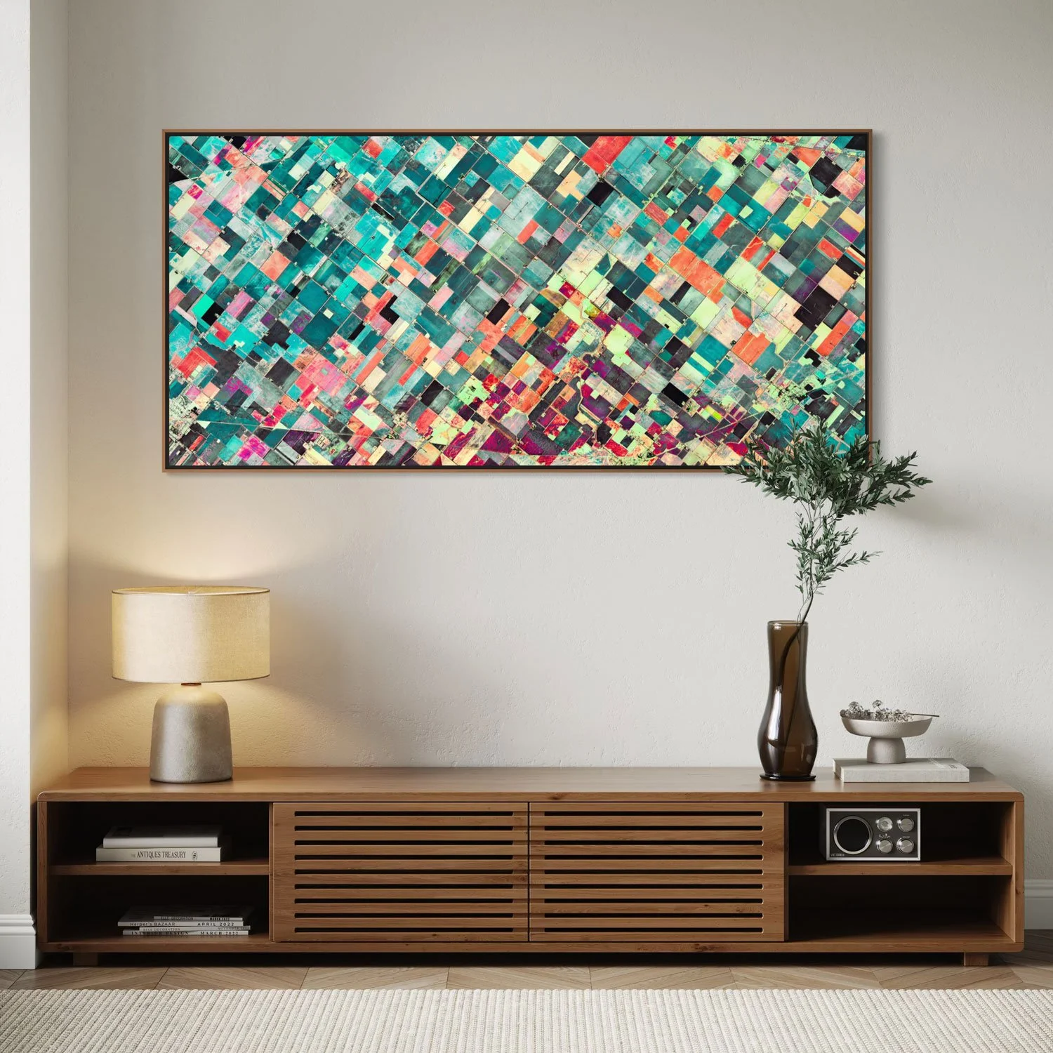 Framed panoramic satellite artwork of agricultural fields in Reese, Michigan, USA, displayed above a wooden console in a contemporary interior.