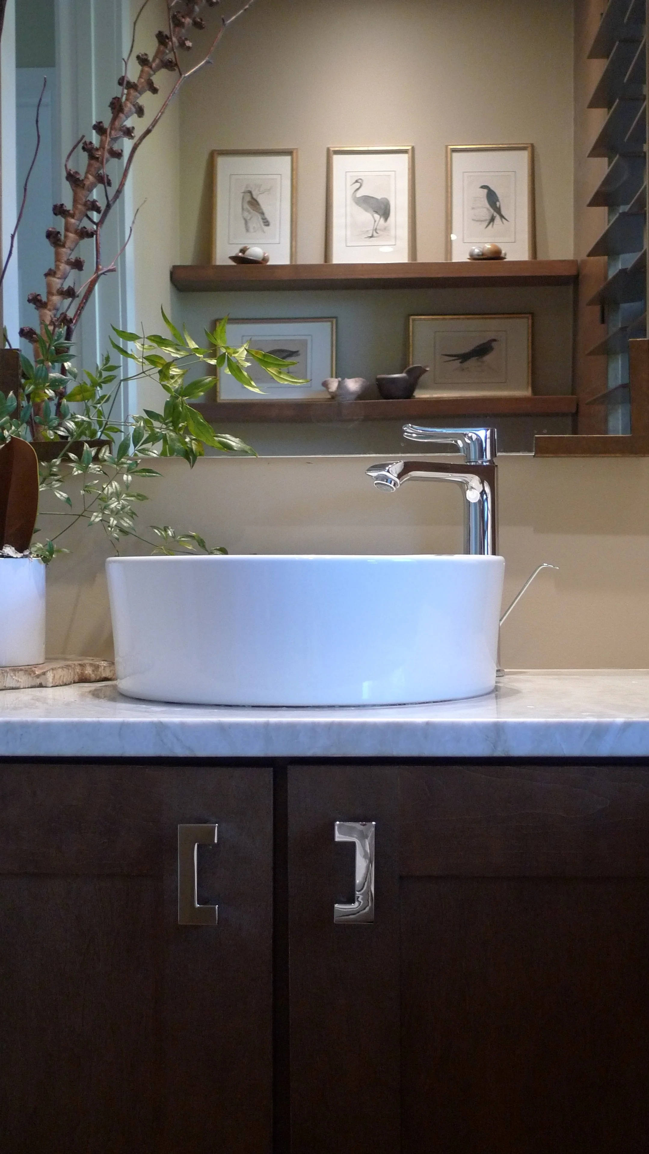 Reflection of painting collection on the opposite wall