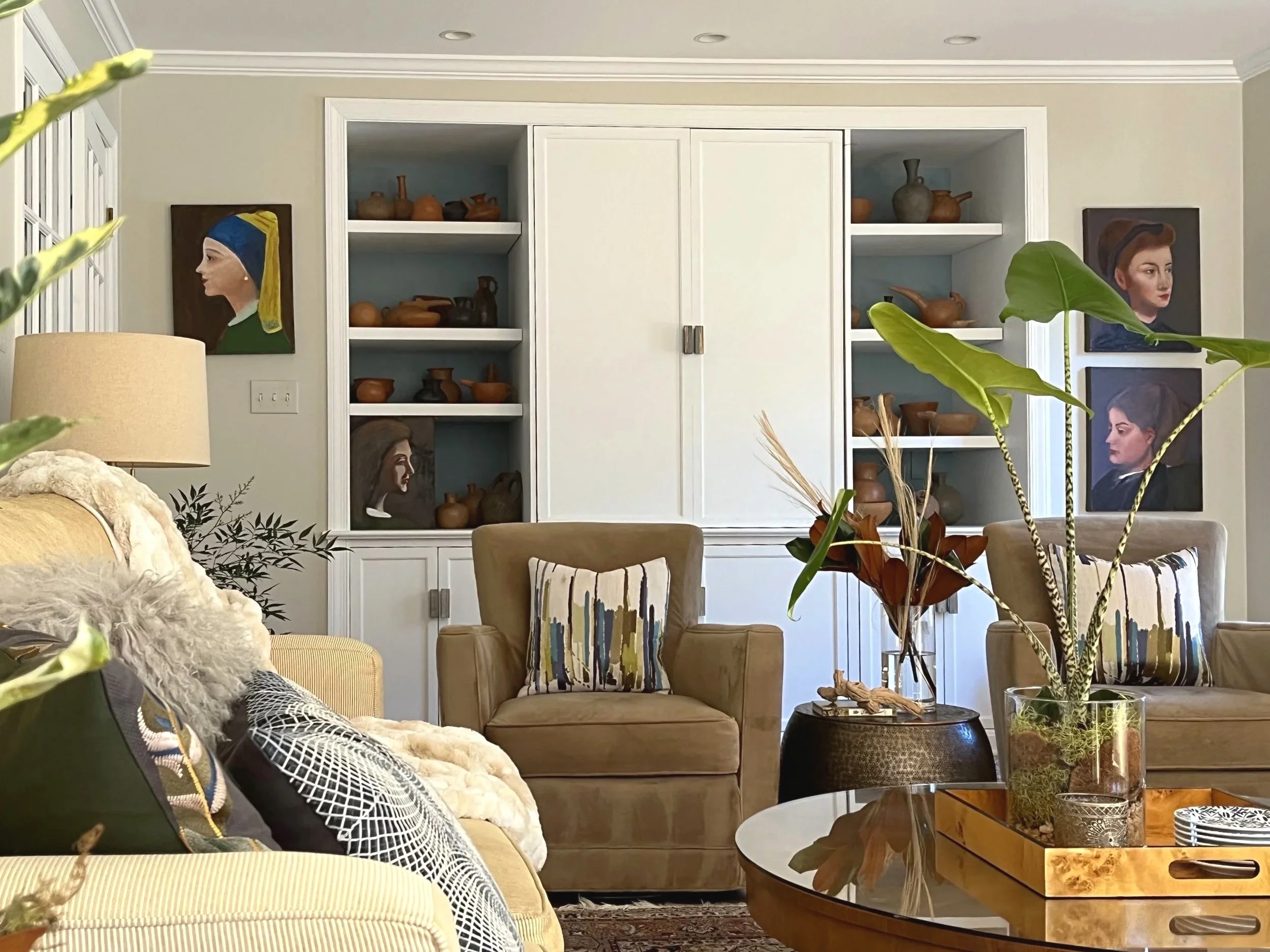 Bethesda MD living room with custom cabinetry showcasing owner's artwork