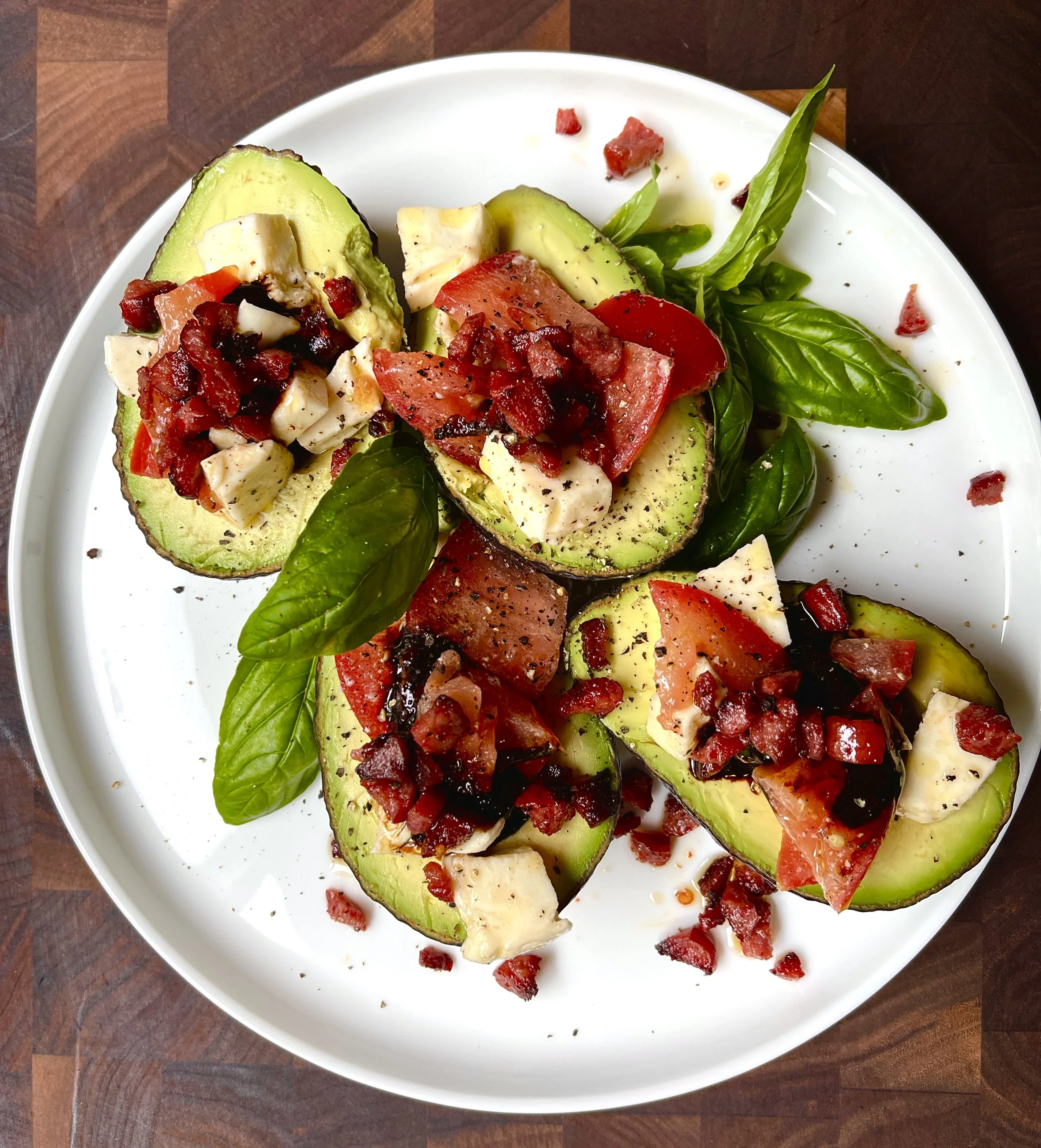 CAPRESE STUFFED AVOCADOS WITH SPICY SMOKED SAUSAGE CRUMBLES