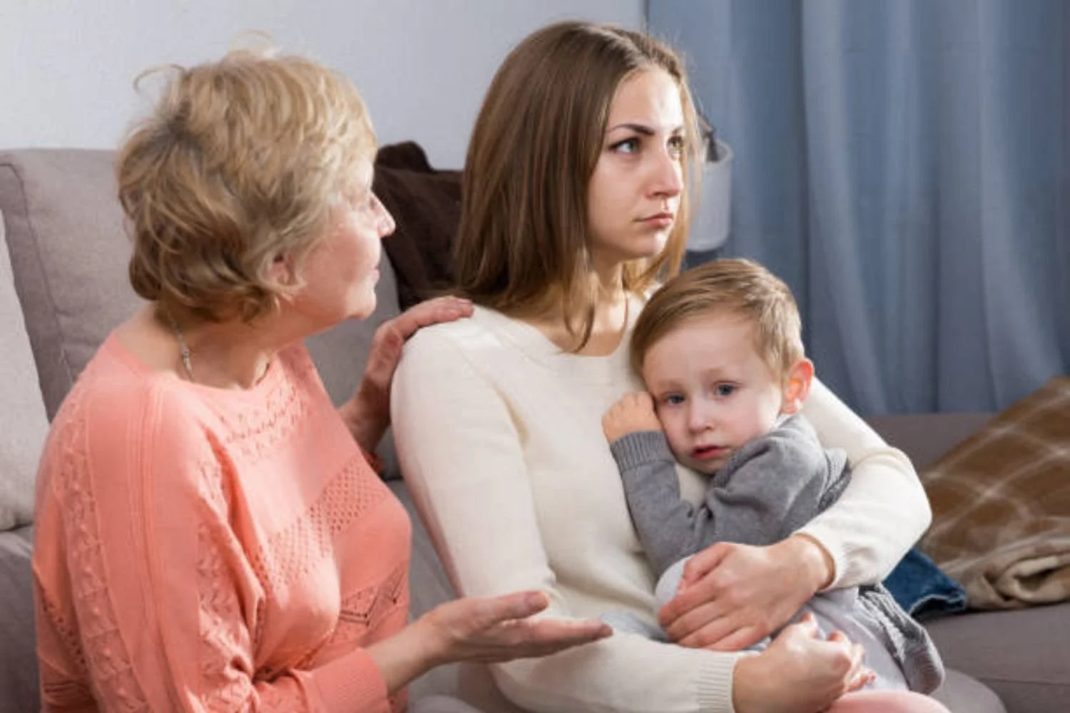 mom holding baby with mother in law