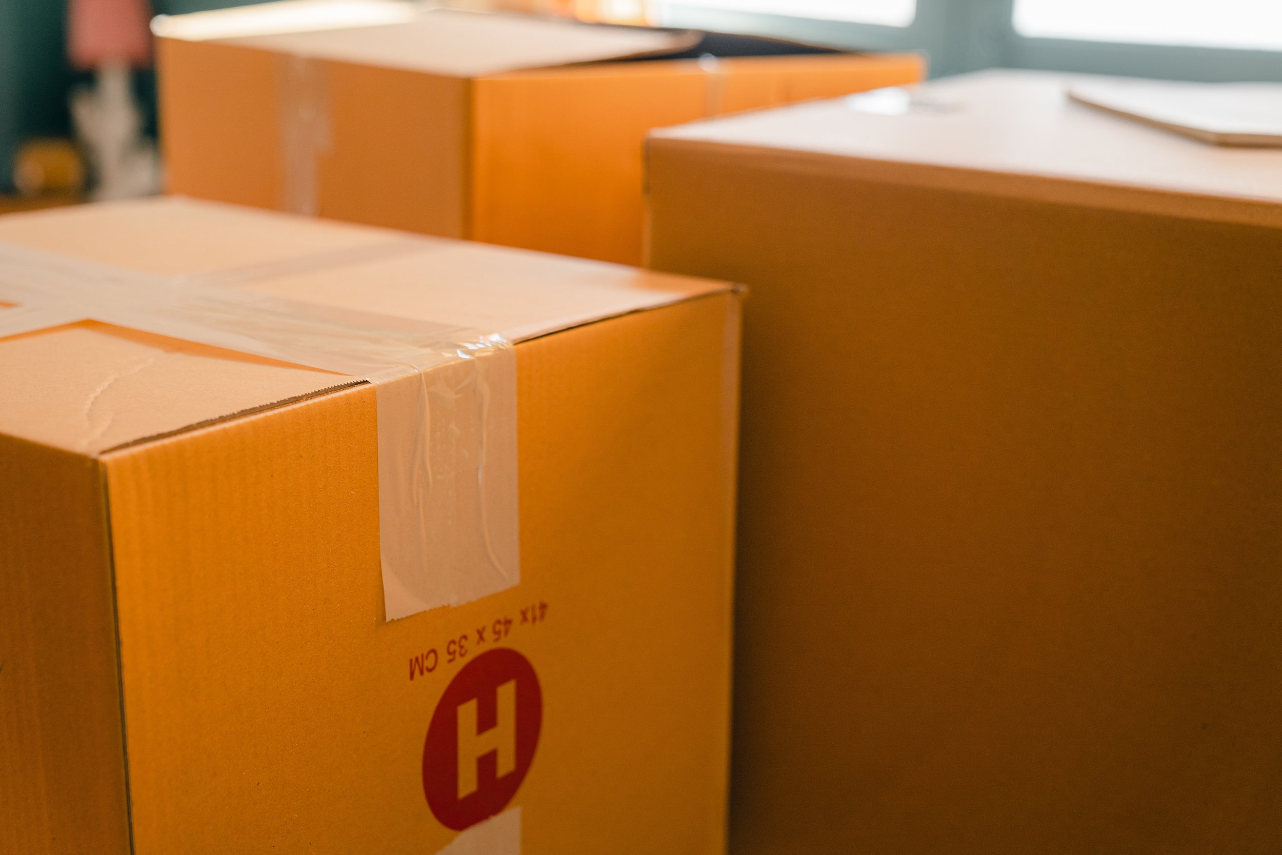 Moving boxes still taped up