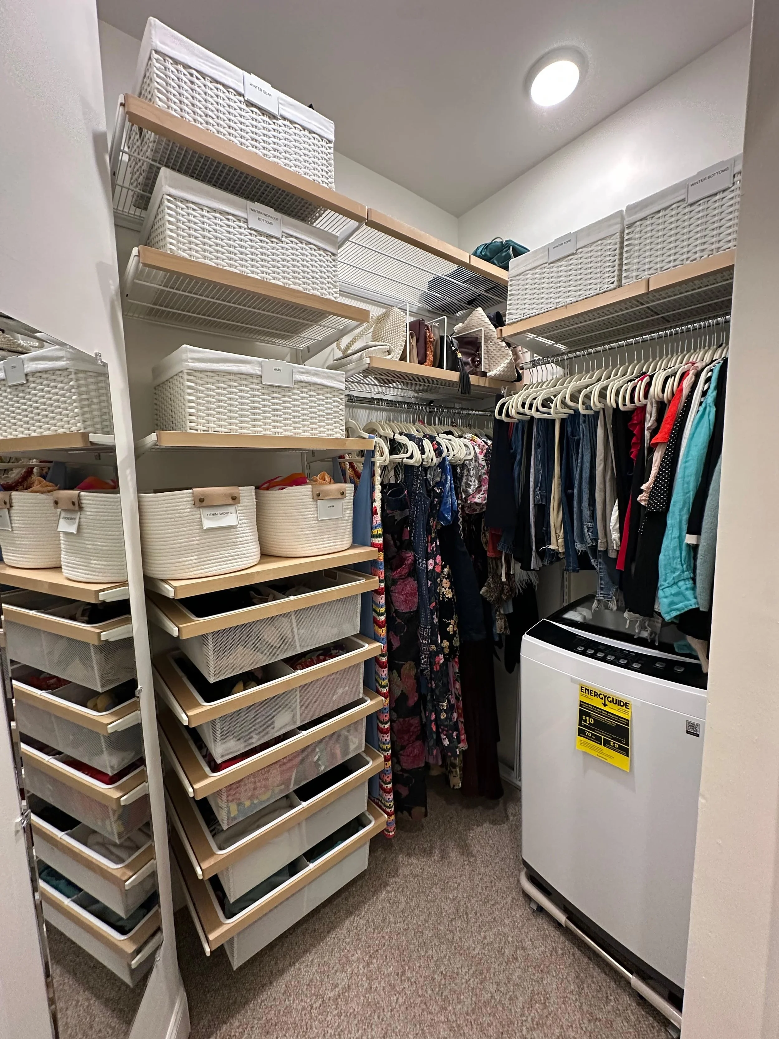 Organized closet with white bins