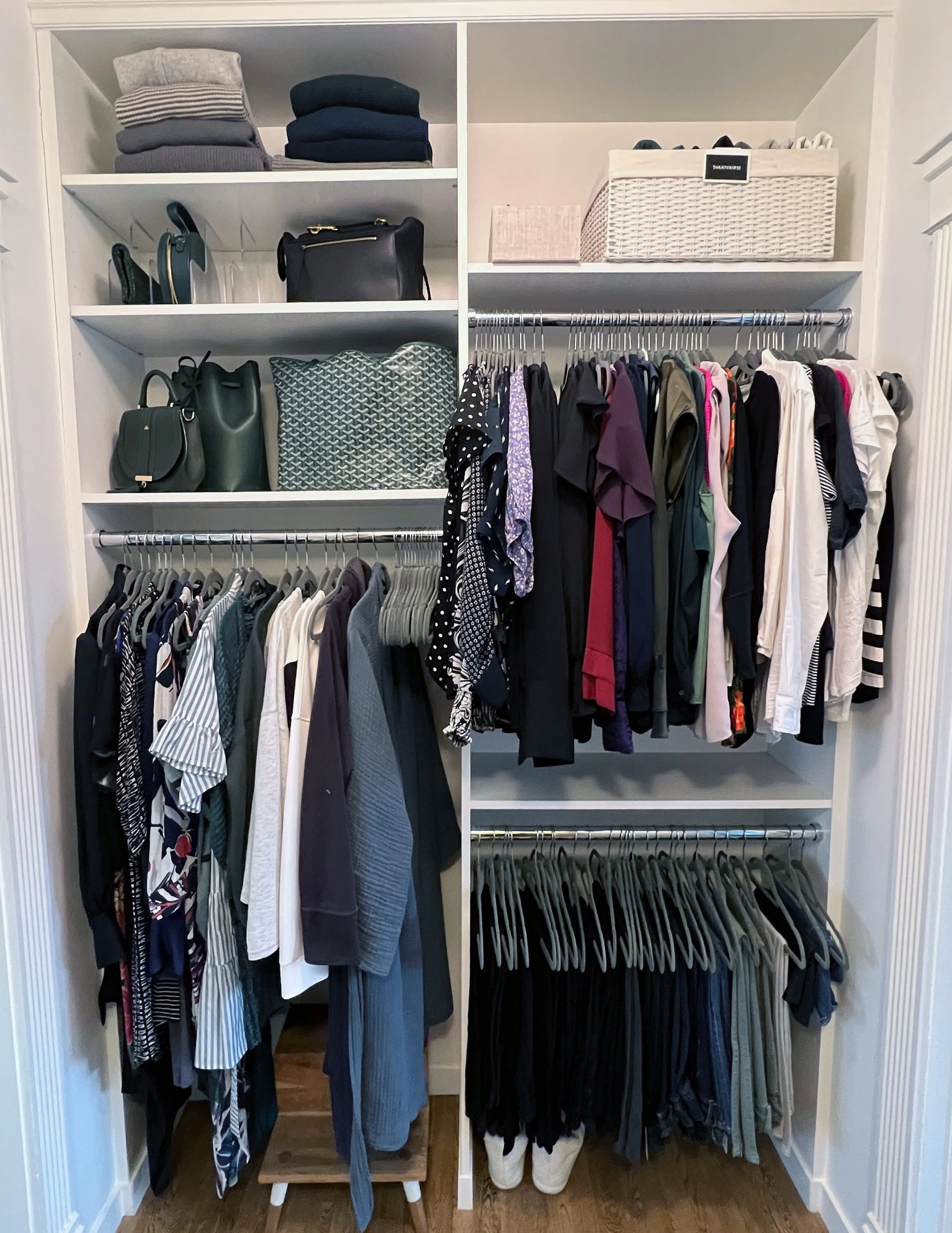Bedroom closet with clothing and accessories.