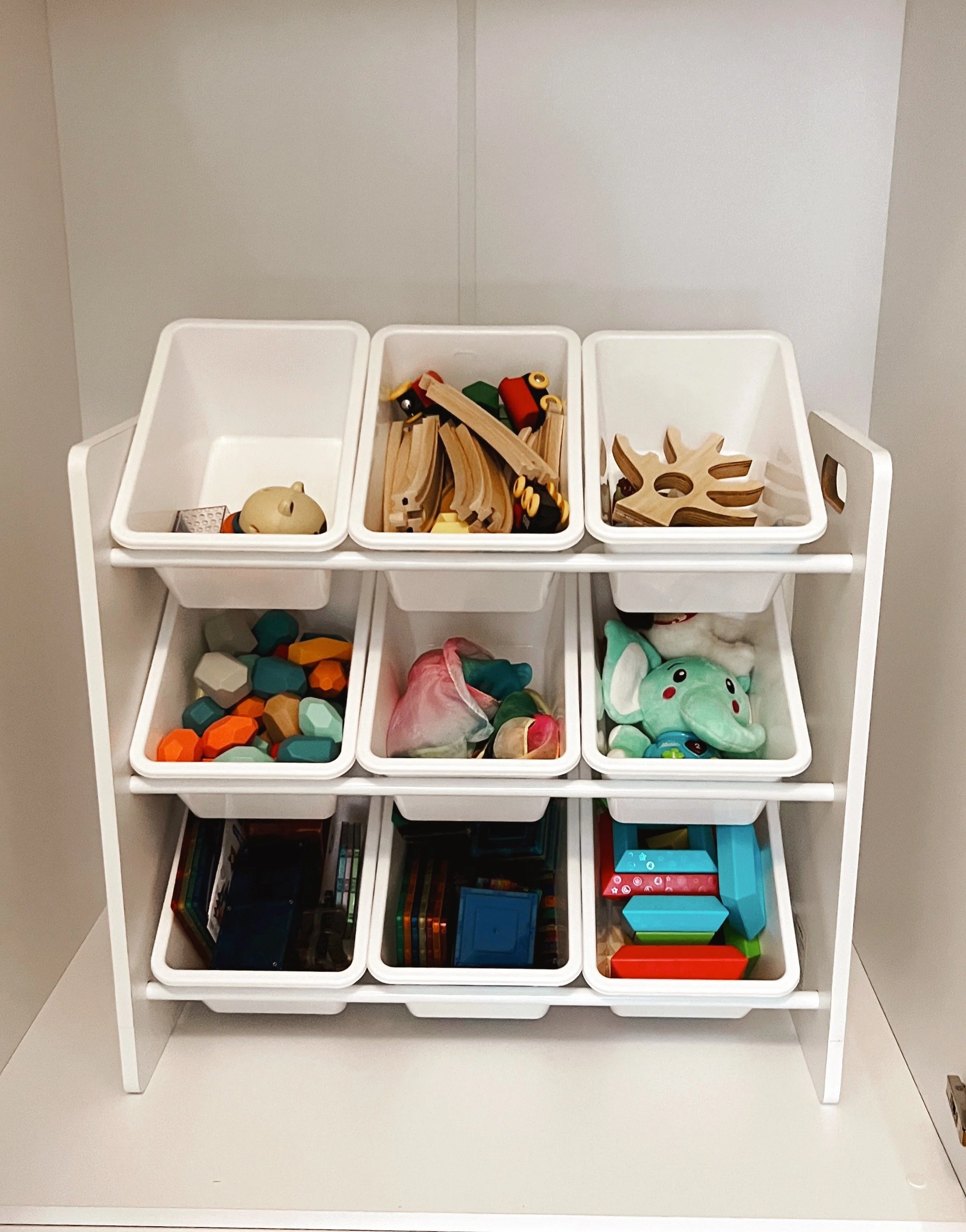 Children's toys organized in easy-to-reach and easy-to-see bins