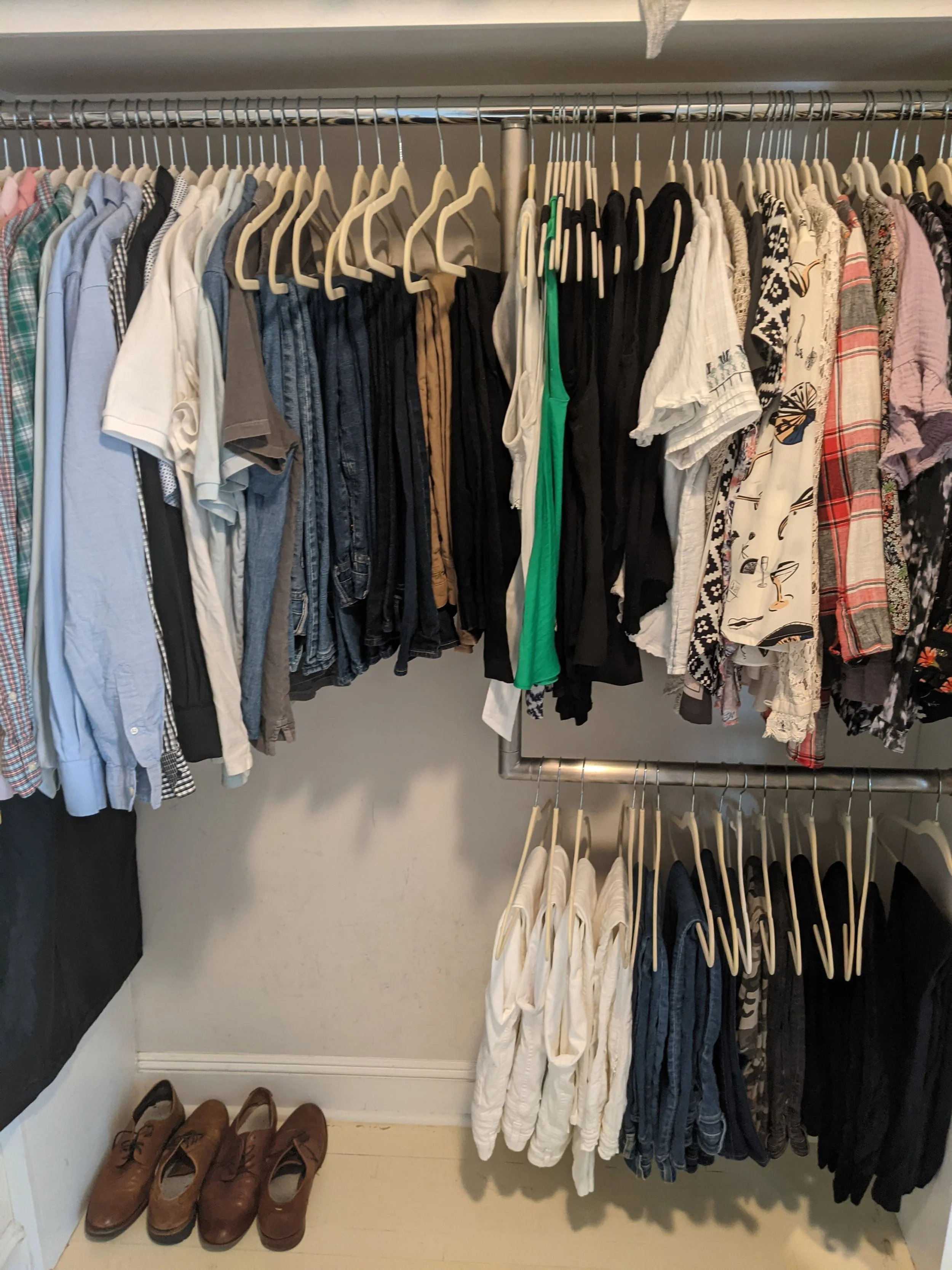 Women's clothing closet organized by color and style