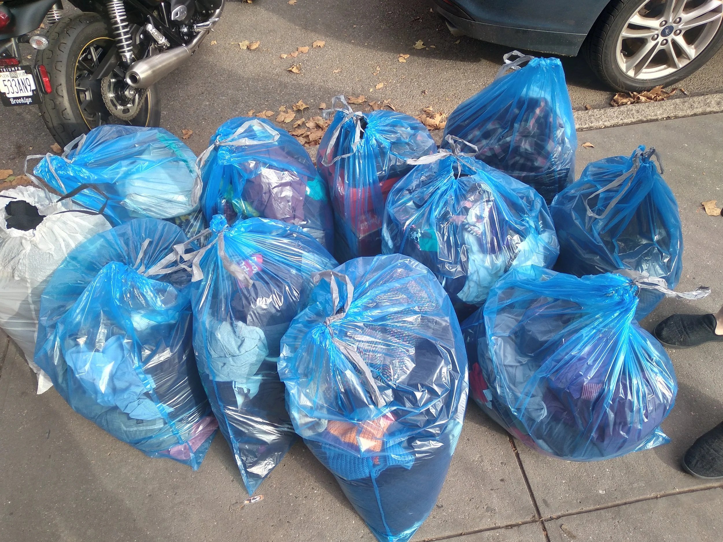 Blue clothing bags full of donations