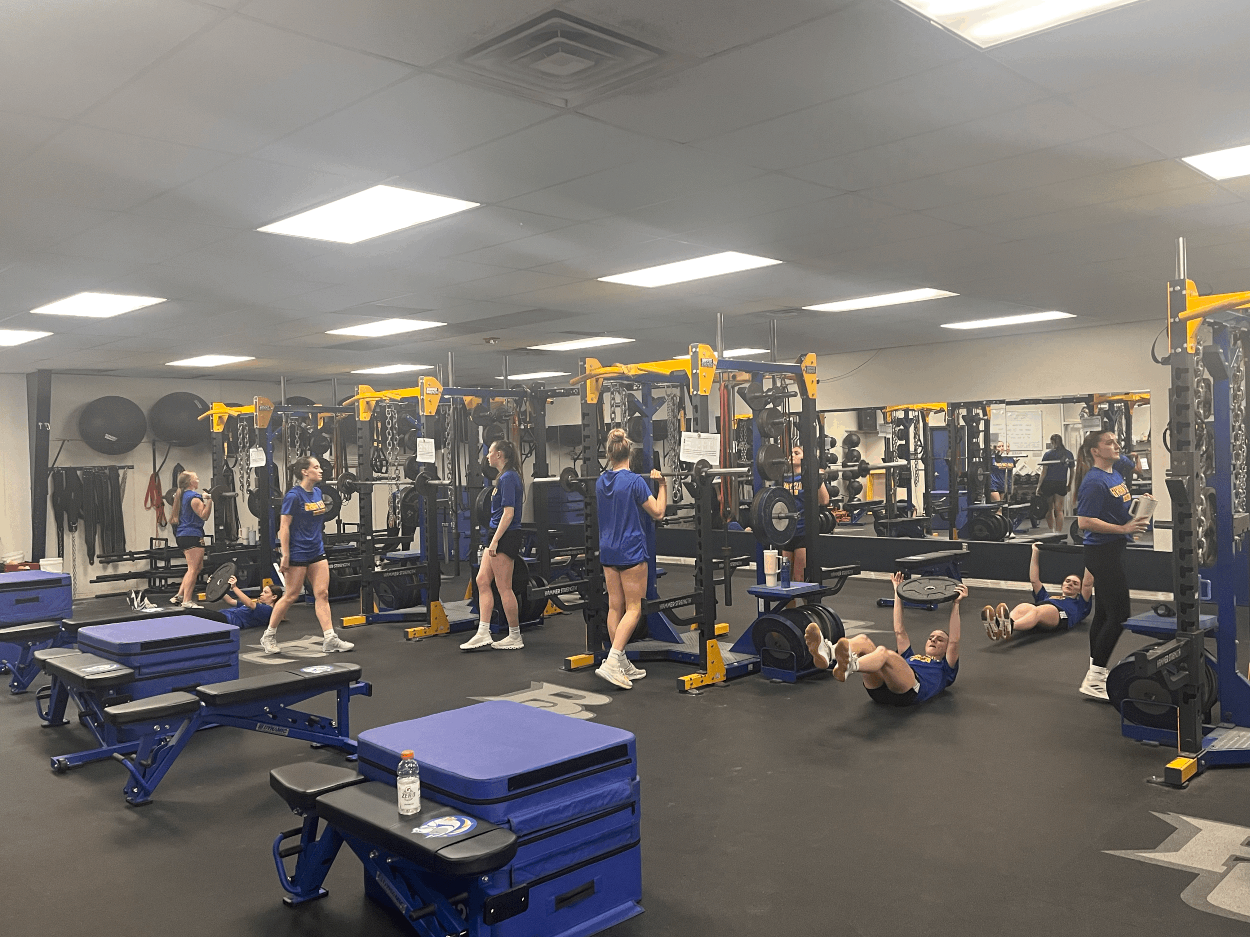 Students athletes training on the new floors of Briar Cliff University weight room.