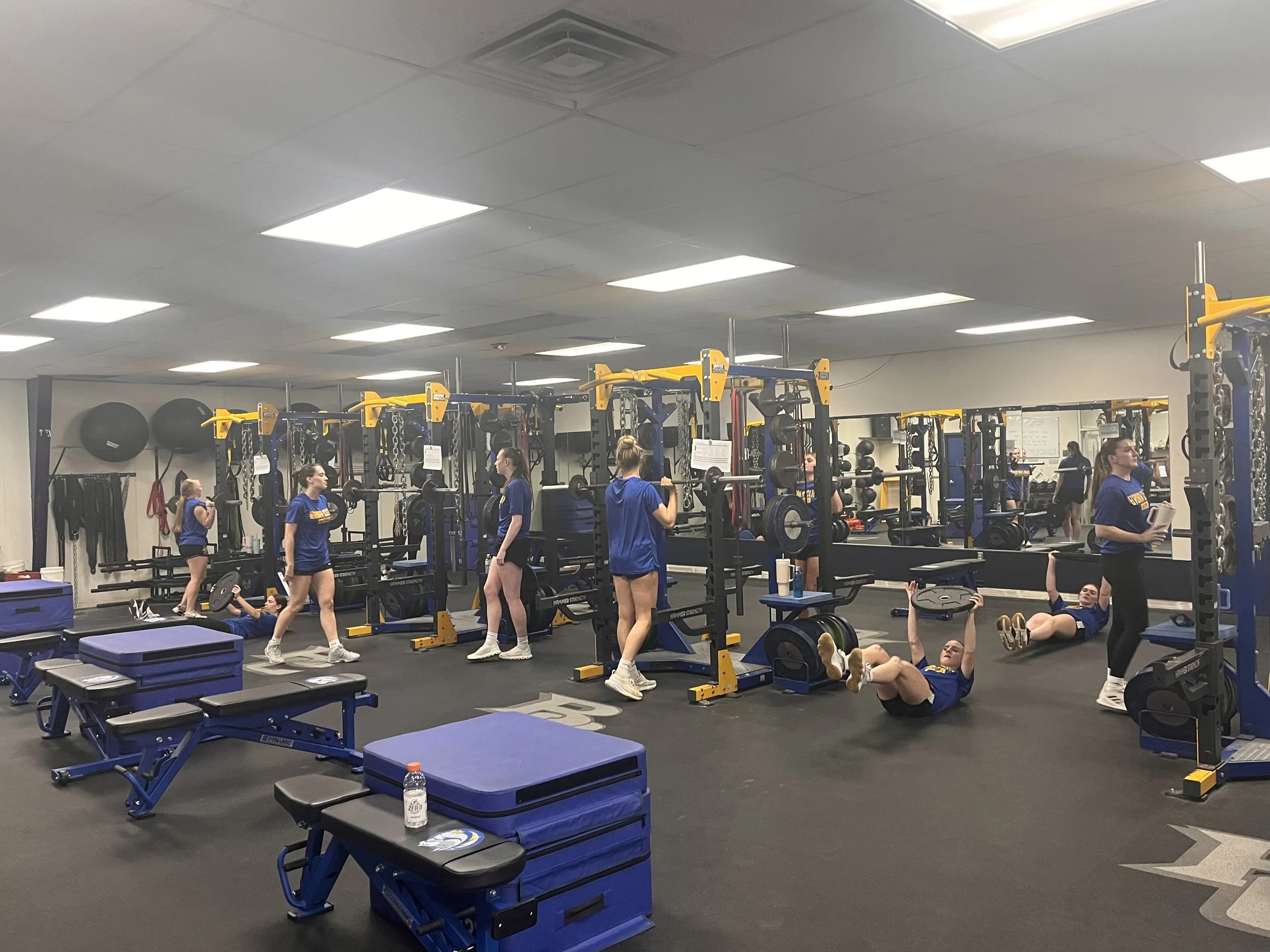 Students athletes training on the new floors of Briar Cliff University weight room.