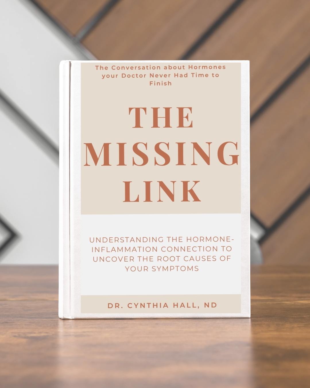A photo of The Missing Link by Cynthia Hall standing up on a wood surface in front of natural and white wood hatching wall pattern