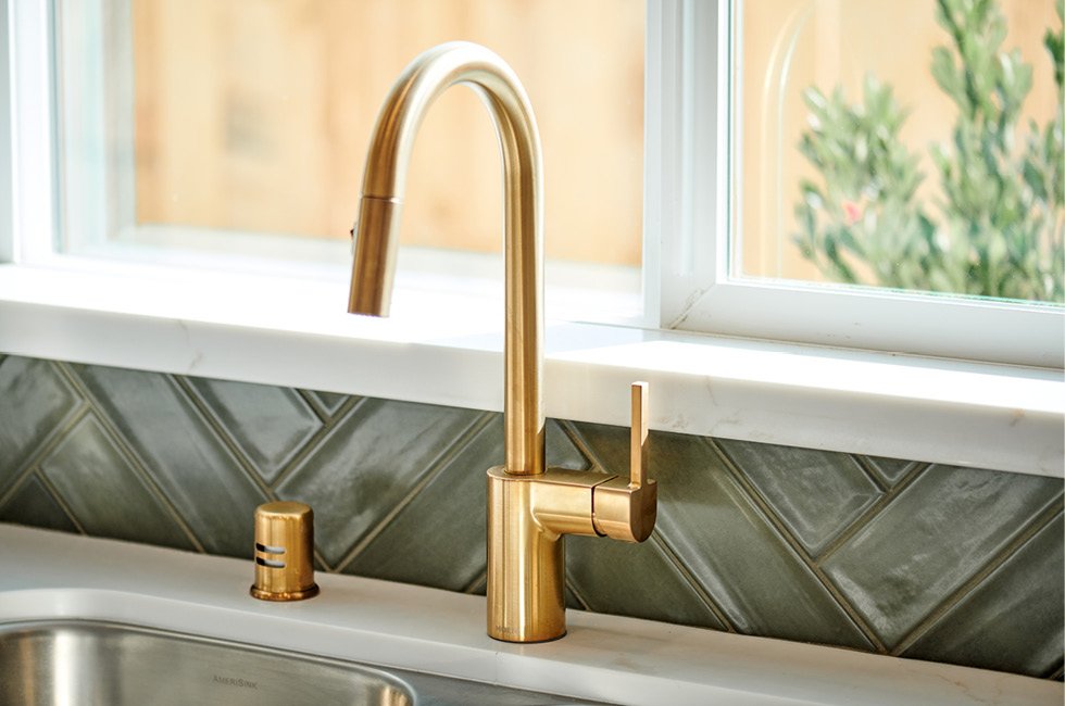 Beautiful gold kitchen faucet  in Marcona model home (residence one) in Keyes, California