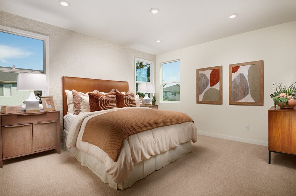 Open and spacious primary bedroom, with beautiful light streaming in. This is in the Marcona model home, Residence One in Keyes, California