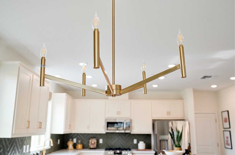 Beautiful lighting fixture in Marcona Residence One model home dining room