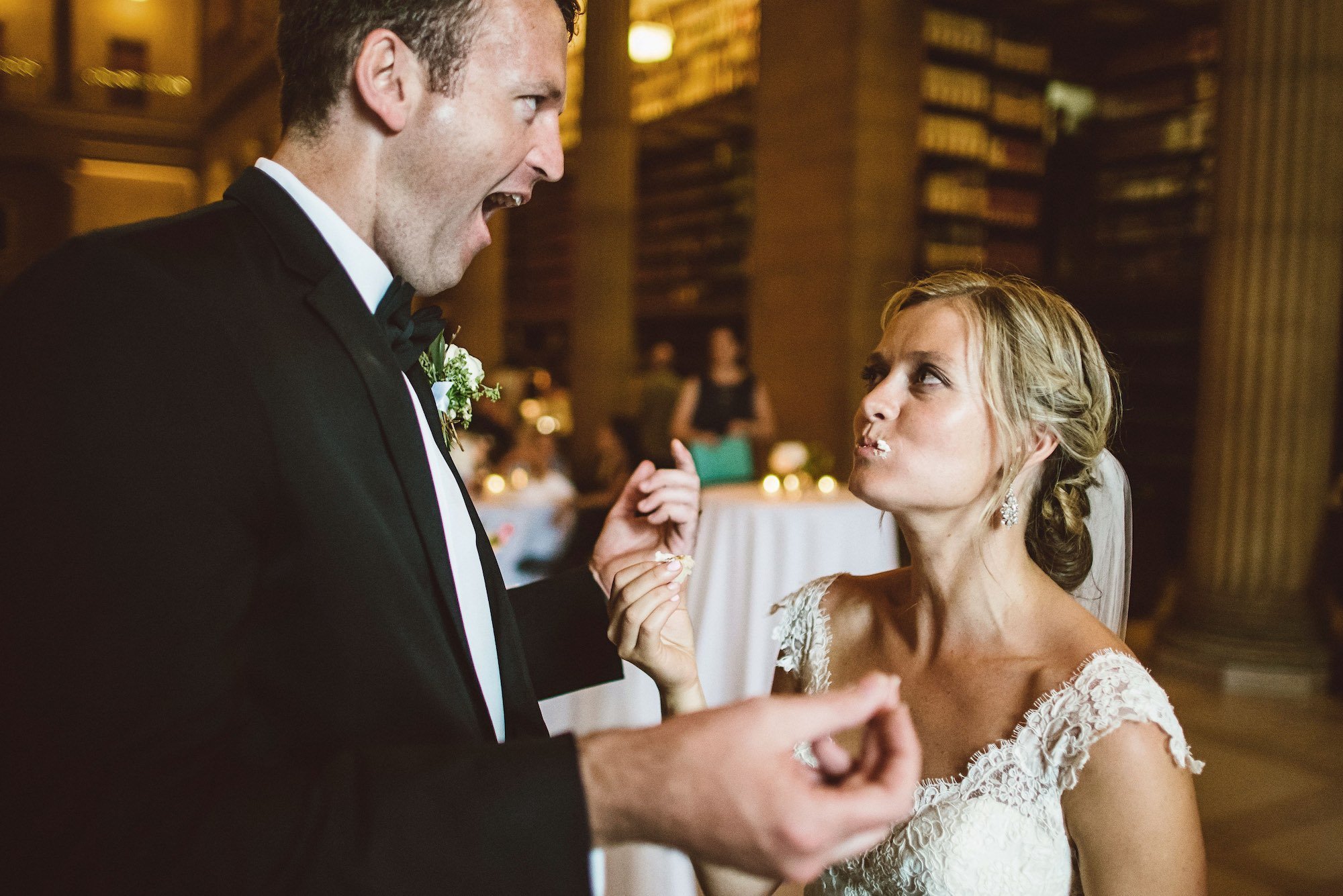 Bride and groom eating cake at their wedding