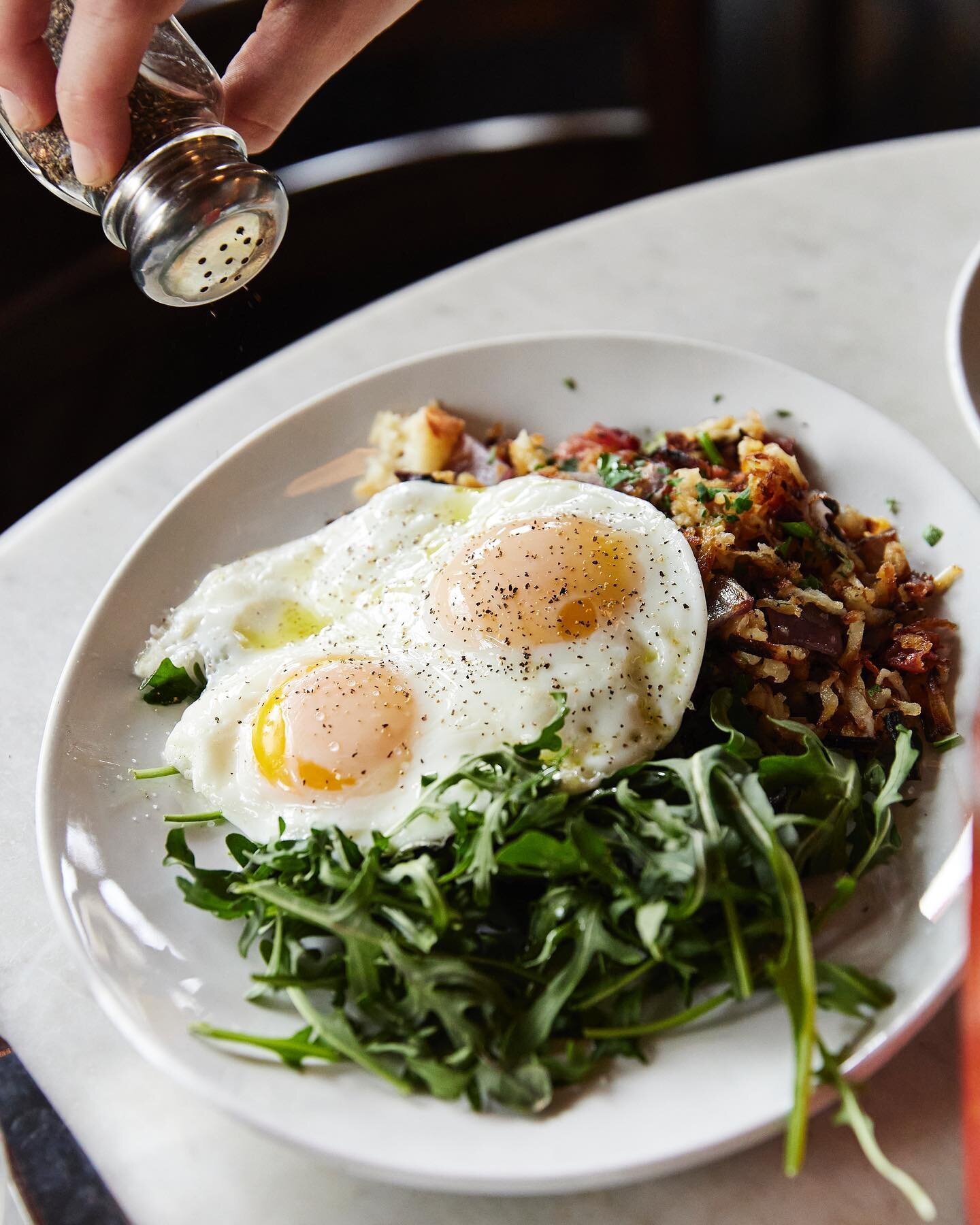 Rise, shine, and dig into brunch. Here&rsquo;s our morning hash with two eggs, hash browns, pancetta, red onion, and grana, roasted in a cast-iron skillet and nestled with fresh arugula. Serving brunch until 3pm!