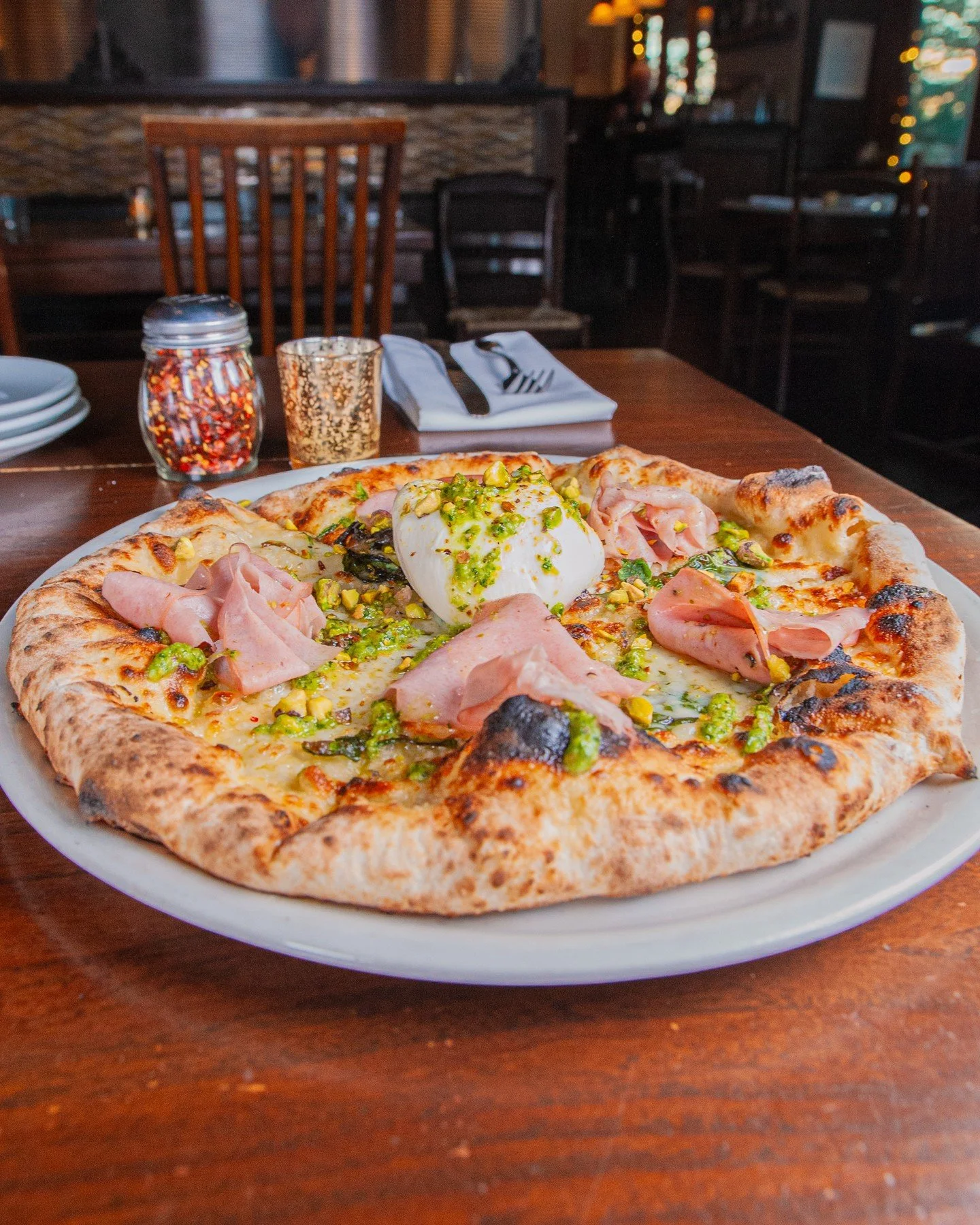 Our special 20th Anniversary Pizza is rich, delish, and only available until Wednesday, March 25th at our Mount Baker location! Mozzarella, basil, pistachio pesto, 4 oz burrata ball, sliced mortadella, and crushed pistachios on a Corto olive oil base