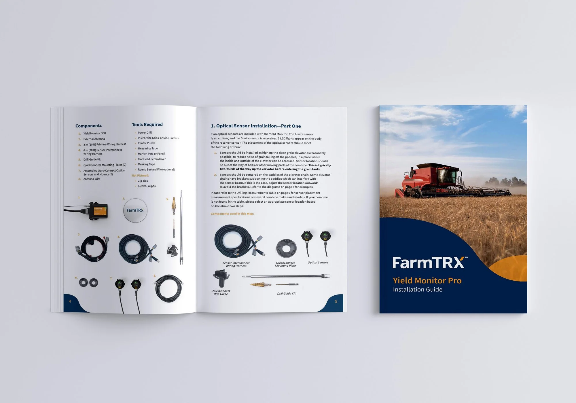 Open FarmTRX Yield Monitor Pro installation guide with components on left page, instructions on right page, and cover showing a red tractor in a field under a blue sky.