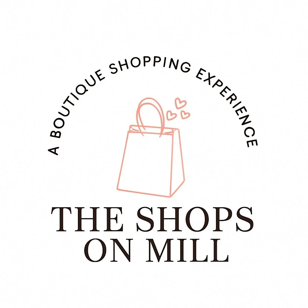 A logo for The Shops on Mill with black lettering and the outline of a pink shopping bag.