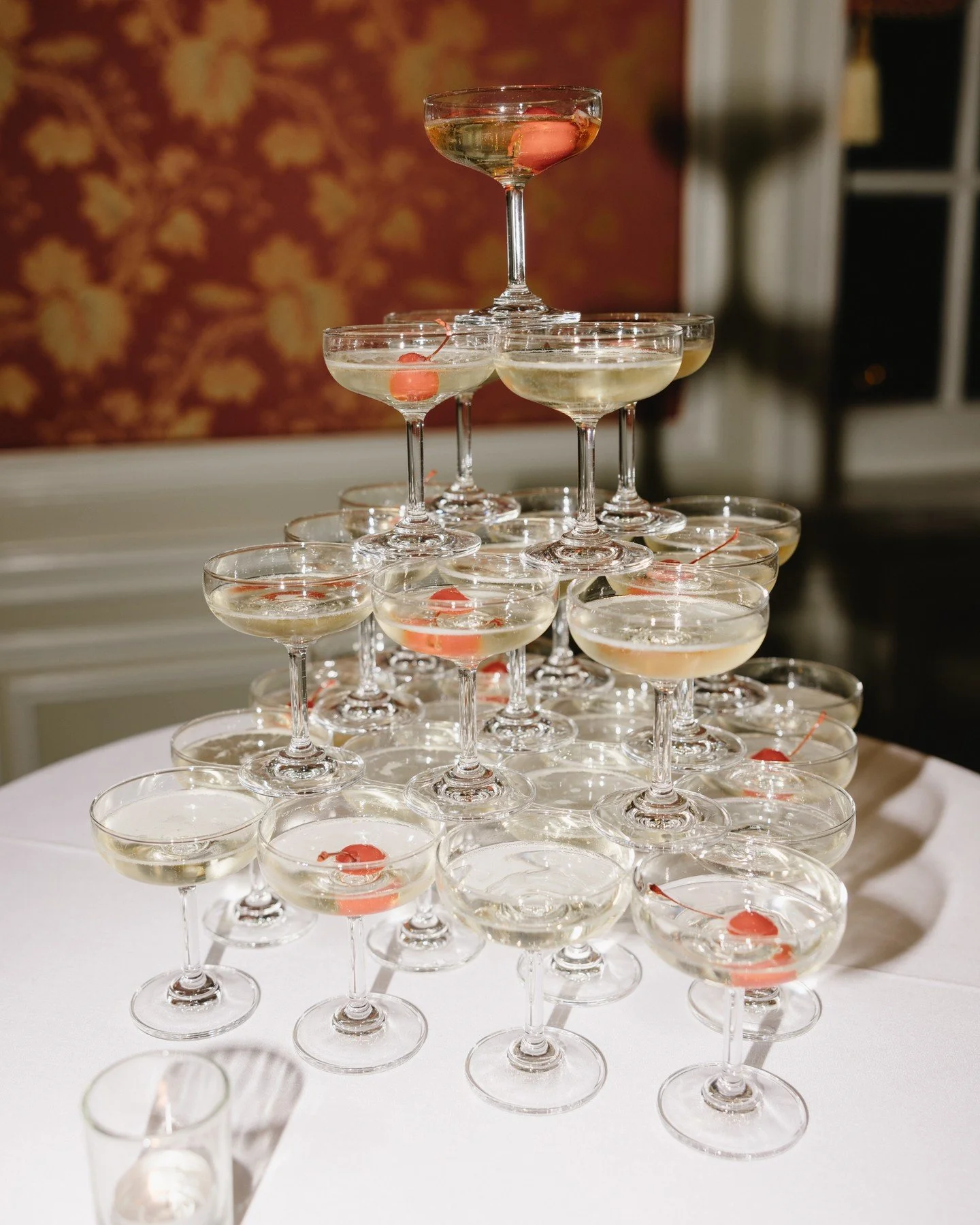 A cascade of champagne, designed for celebration 🥂

Planning &amp; Design - @weddingsbystardust
Photography - @jamieparkphoto
Venue &amp; Catering - @fortworthclubweddings

#rehearsaldinner #weddingplanner #uniquedesign #champagnetower #bride #groom