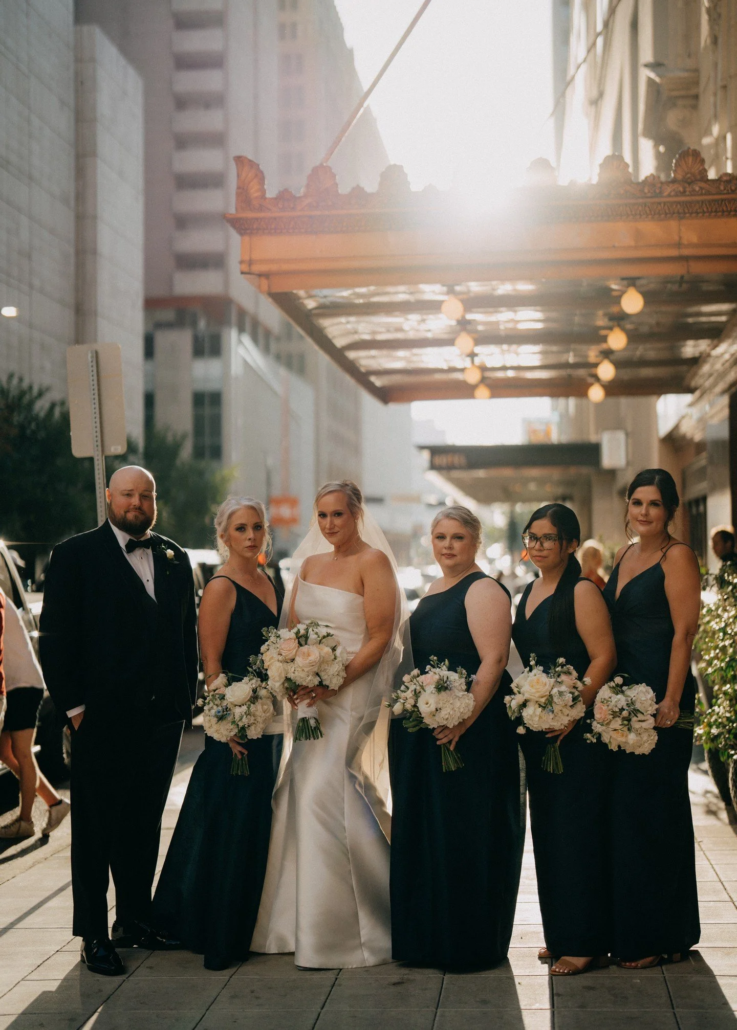 One word to describe J+T's wedding at @theadolphushotel? Chic. From the black attire worn by Jenn's attendants, the white cherry blossoms covering the ceremony and reception, or the Governor's Ballroom sheer beauty, their wedding day was one for the 