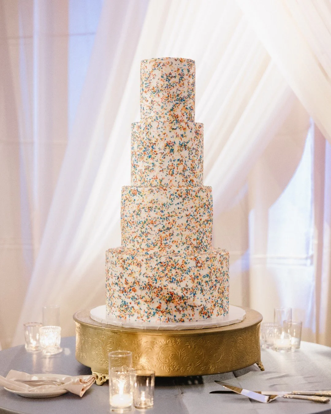 Distracting ourselves from the icy conditions outside and getting lost in photos from J+E's wedding day. Taking a break from tradition, the couple opted for a colorful, four tier sprinkle cake that truly stole the show!

Planning &amp; Design - @wedd