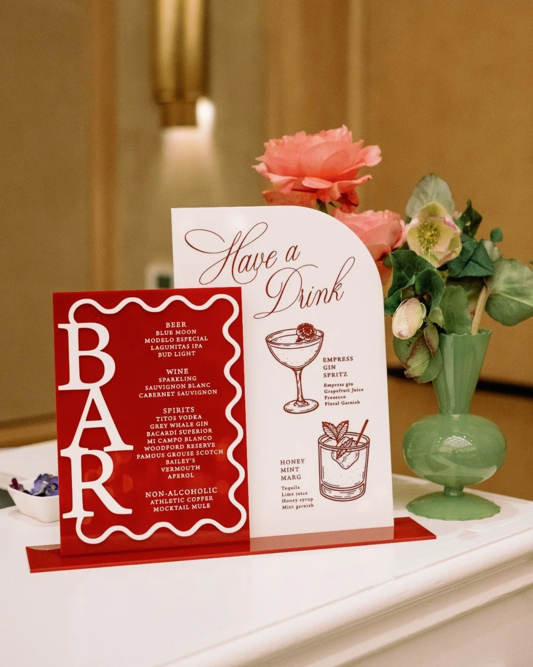 For K+B, the bar was just as thoughtfully styled as the tables. Acrylic signage, cocktail napkins, and fabric details all perfectly color-matched for a seamless monochromatic moment. 

Planning &amp; Design - @weddingsbystardust
Acrylic Signage - @hu