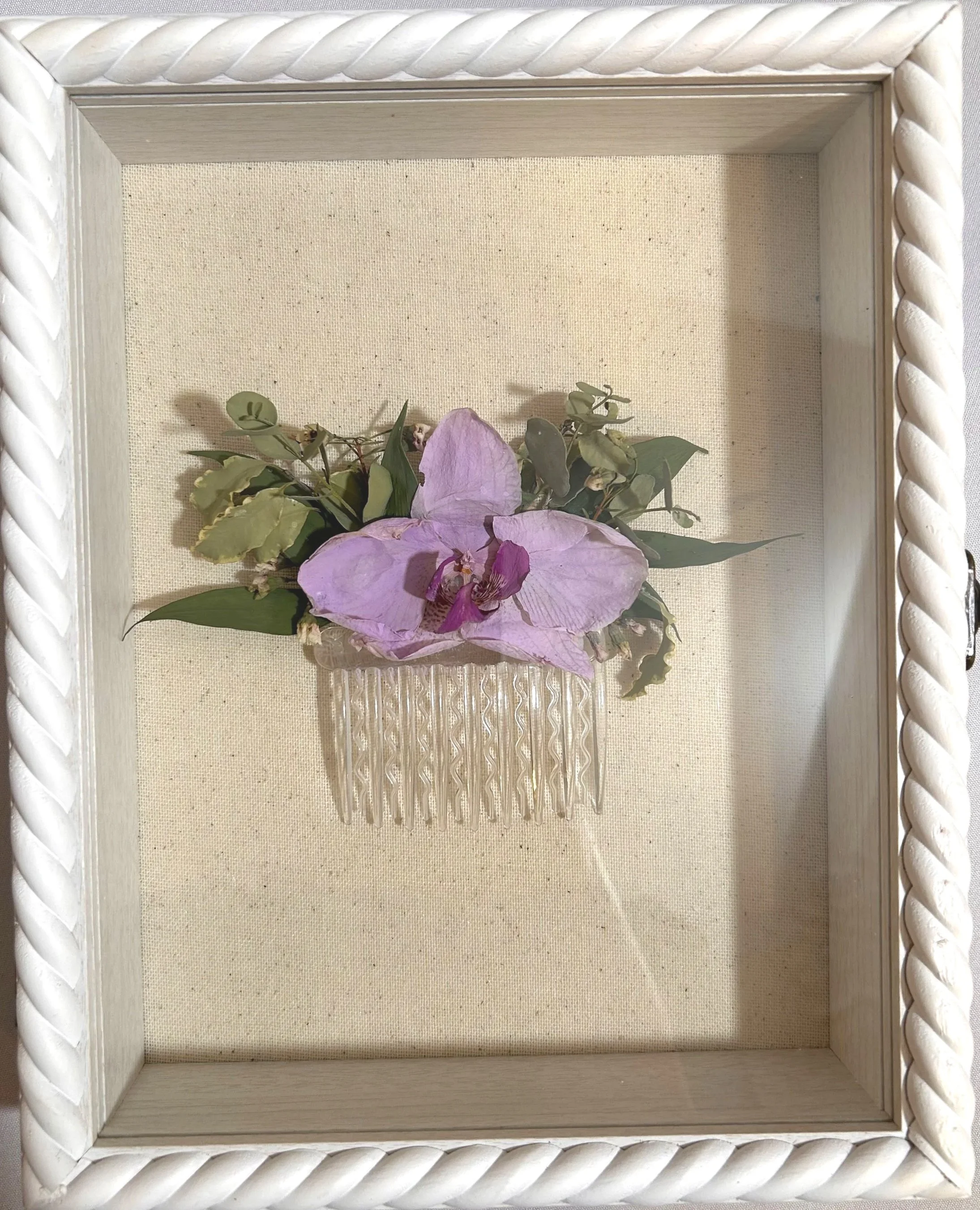 8x10 braided shadowbox featuring mother of the bride's hairpiece, color corrected