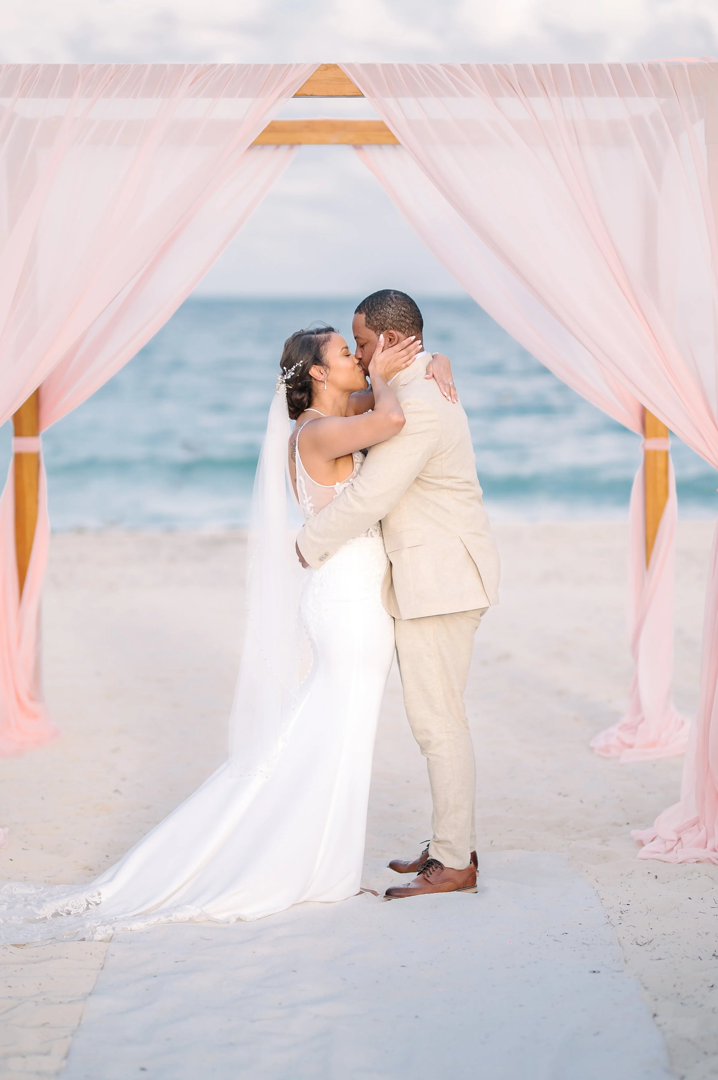 First kiss at a wedding ceremony at Secrets Restort in Cancun, Mexico.