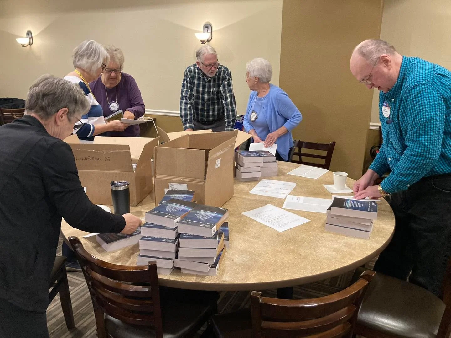 At this morning&rsquo;s meeting, Rotarians assembled boxes of dictionaries that we will deliver to local 4th graders. The dictionaries also feature an atlas and other useful content. Each child receives their very own dictionary thanks to this annual