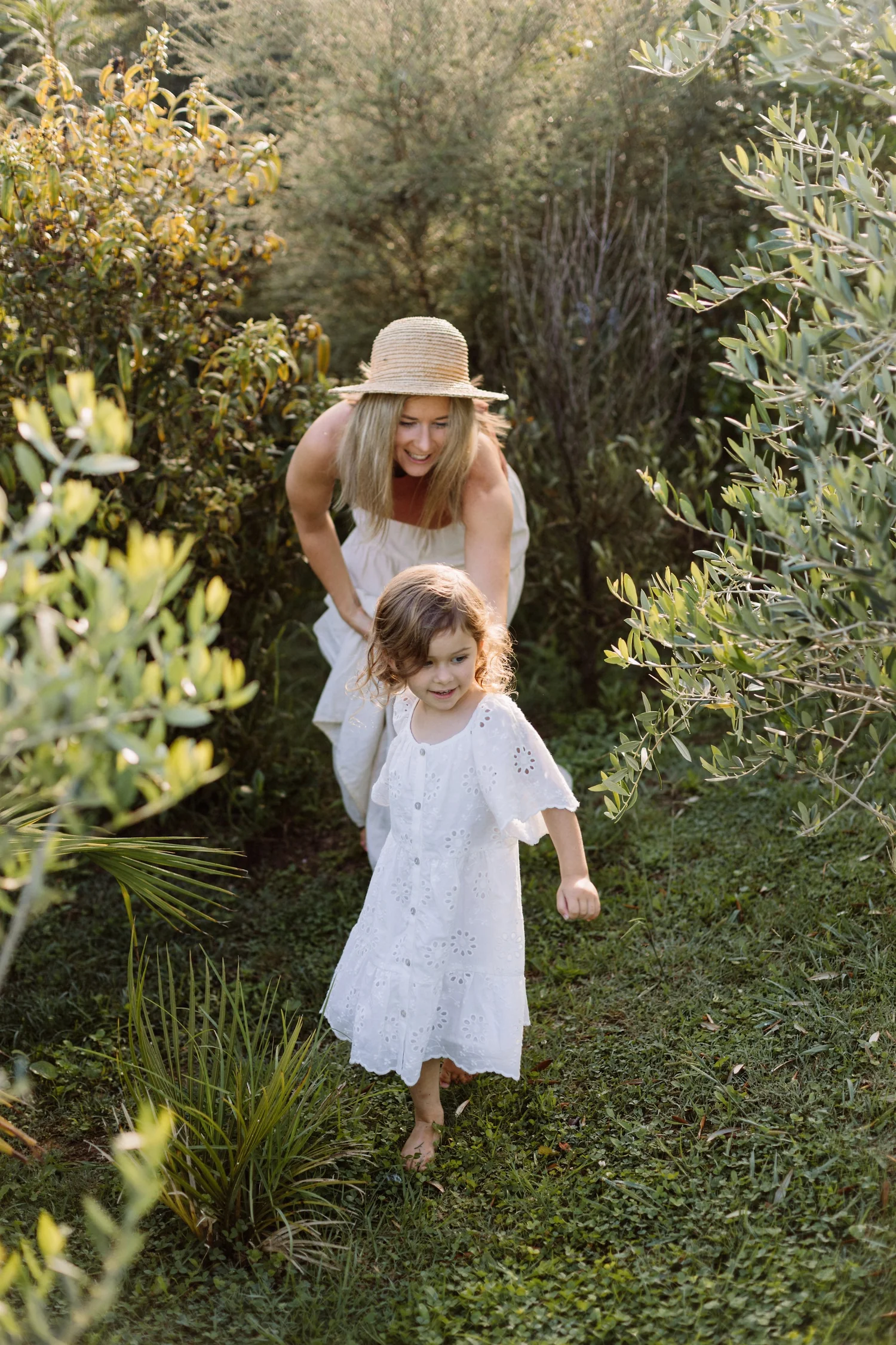 Kirstie Vesseur, perimenopause nutritionist, walking in her garden with her daughter