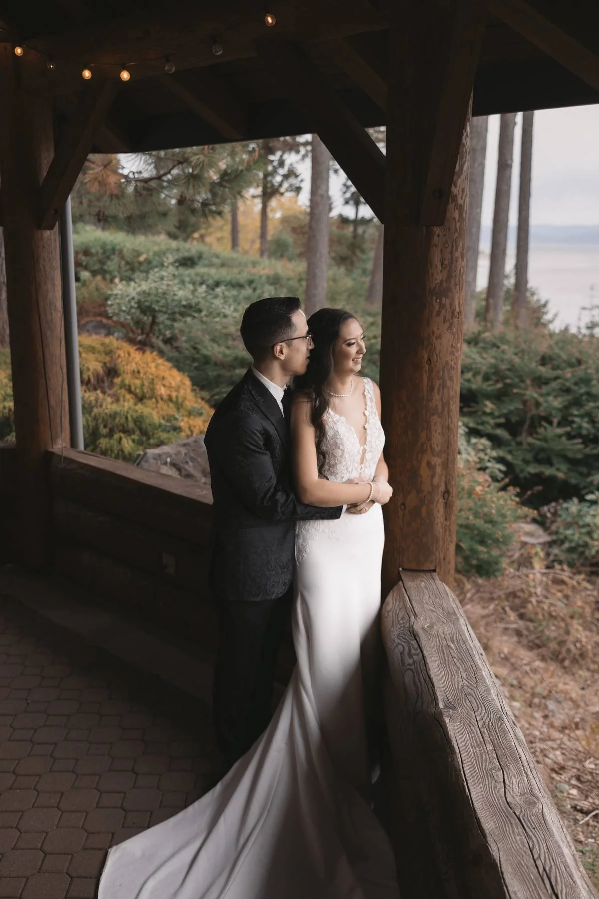 Bride and groom portrait at Tigh-Na-Mara Seaside Spa Resort gazebo overlooking the ocean in Parksville, British Columbia