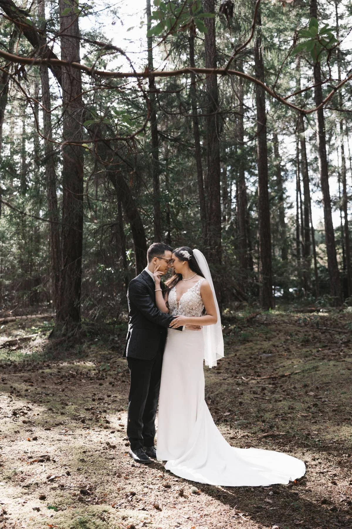 Bride and groom portraits in forest at Tigh-Na-Mara wedding in Parksville