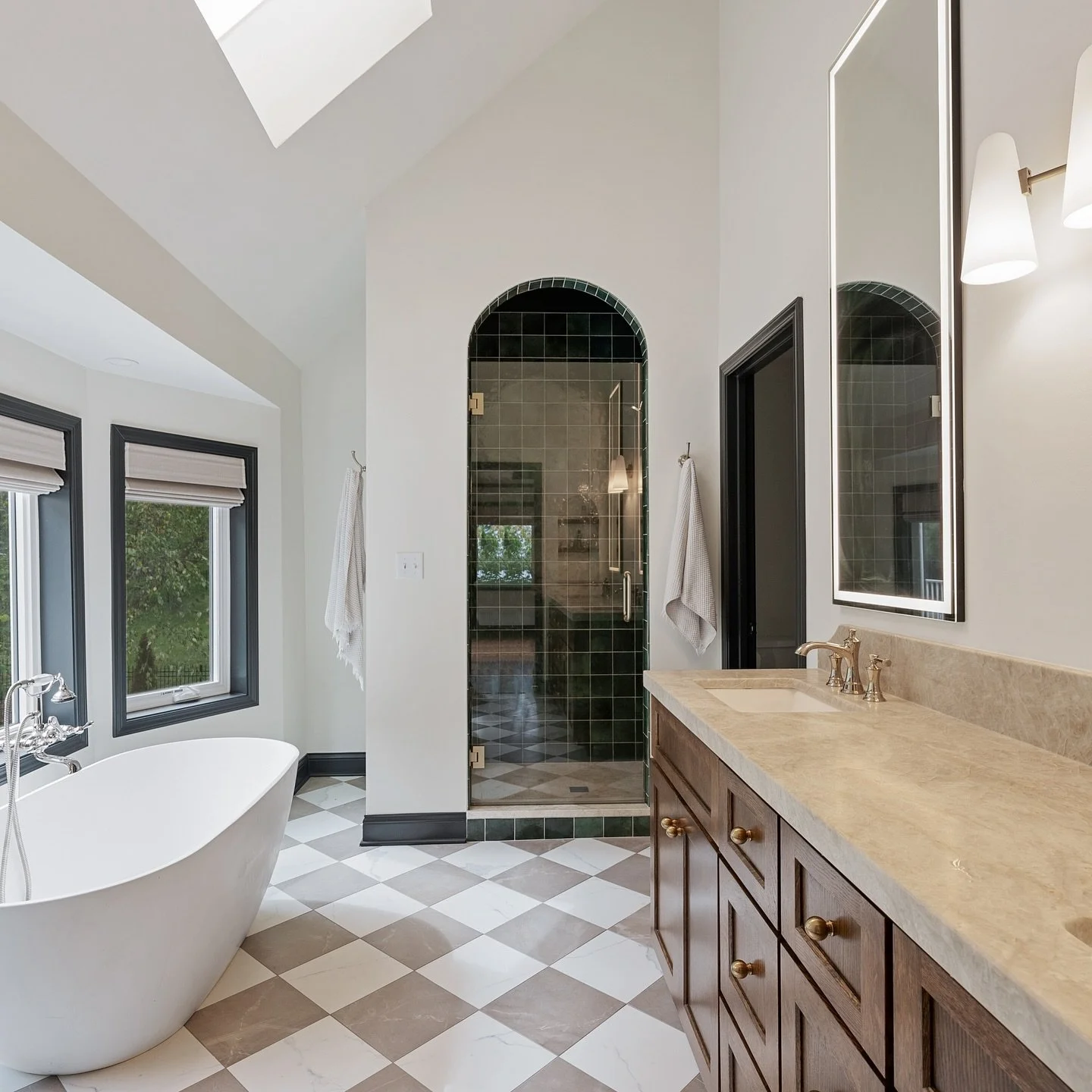 Same POV &mdash; before, during and after! 🛁 This primary bath is unrecognizable. We relocated the vanity, added a freestanding tub and created the arched shower of our dreams. ✨ #RenovatingKC #PrimarySuiteRenovation #KansasCityRenovation