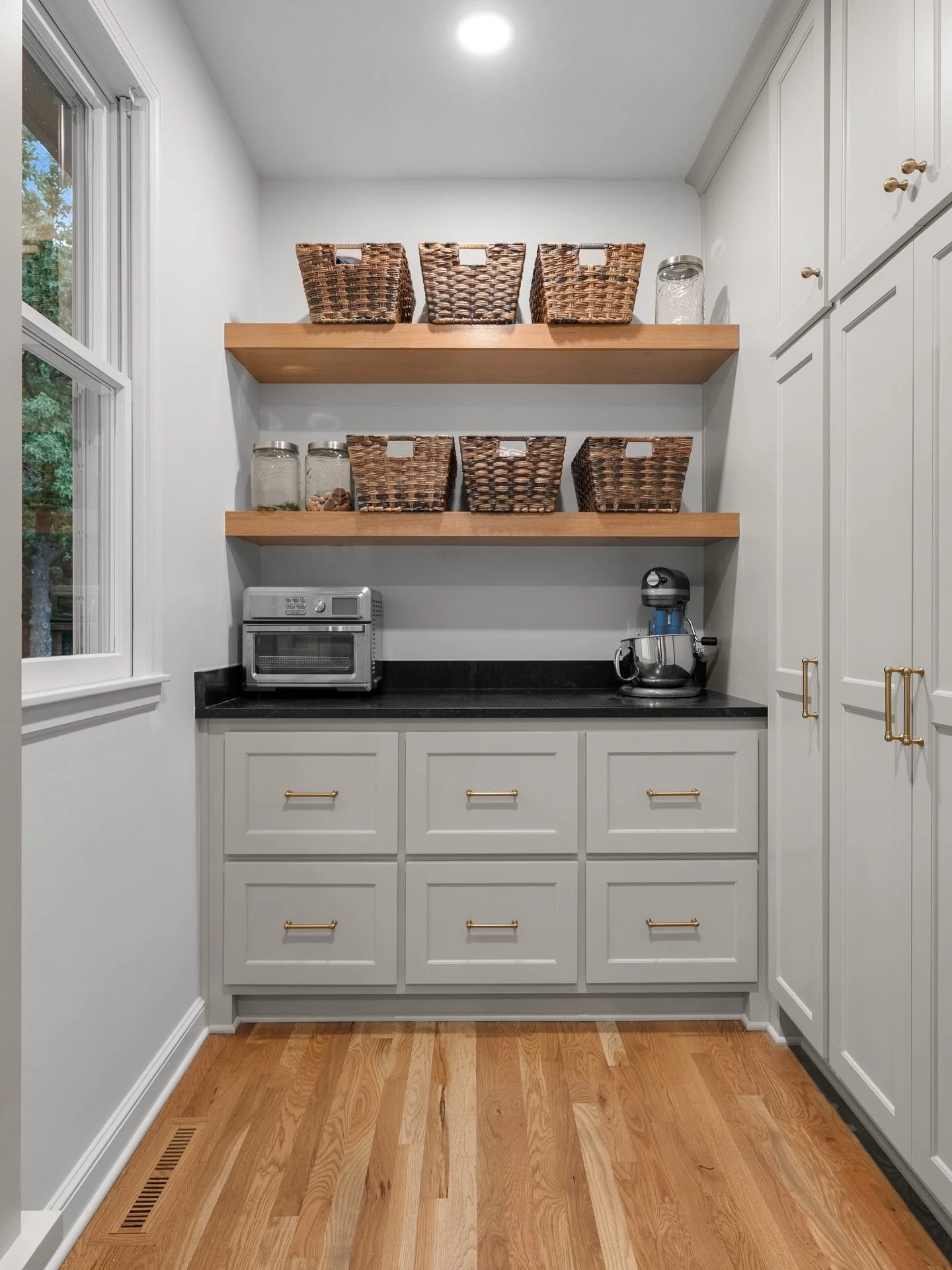This walk-in pantry + mudroom combo in this Leawood home remodel is the best! 
✨ Hidden storage for snacks, small appliances &amp; bulk items
✨ Drop zone for backpacks, shoes &amp; coats

#renovatingkc #kansascityremodel #pantrydesign #mudroom #homeo