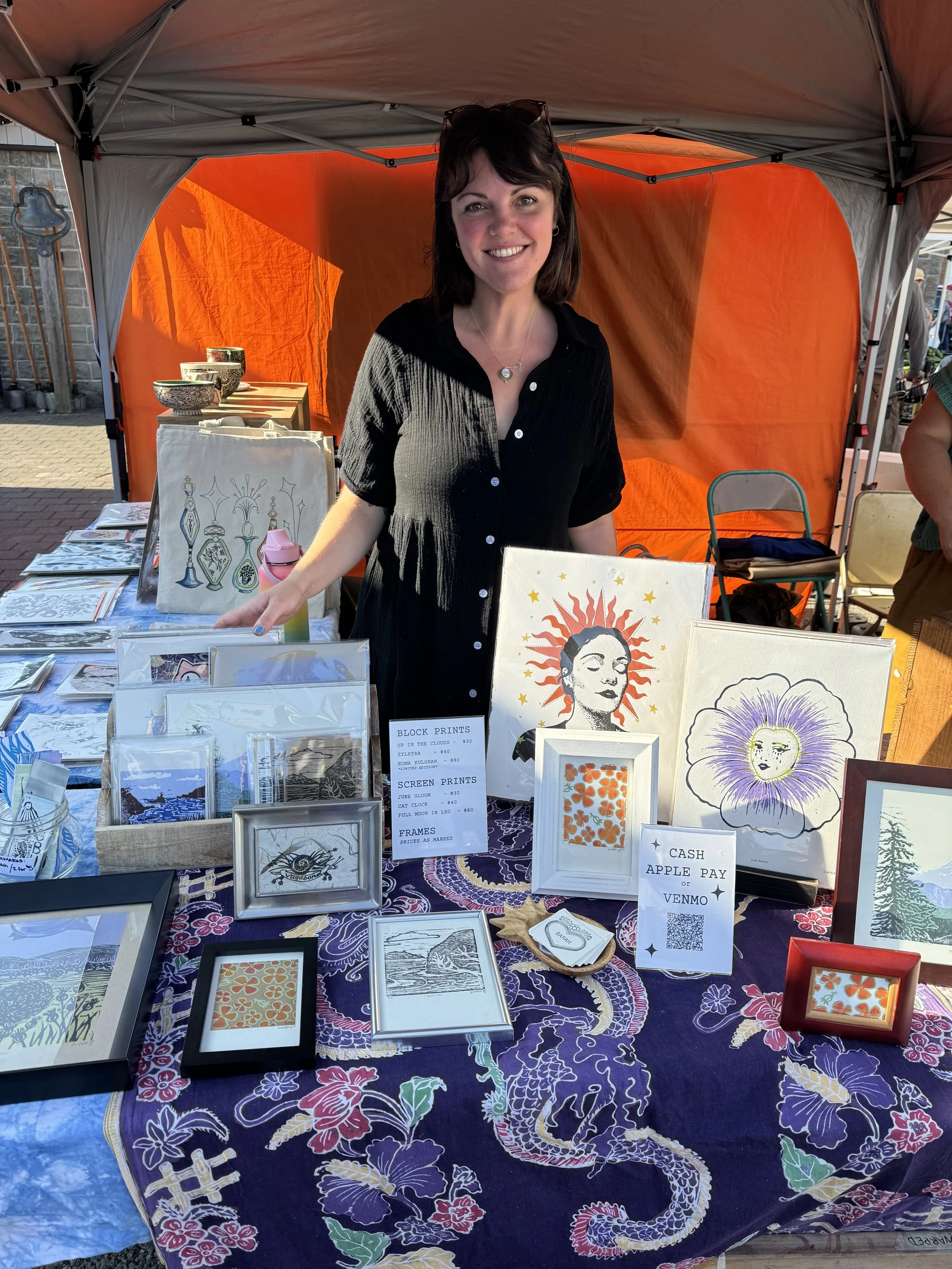 Sarah with her art at the farmer’s market