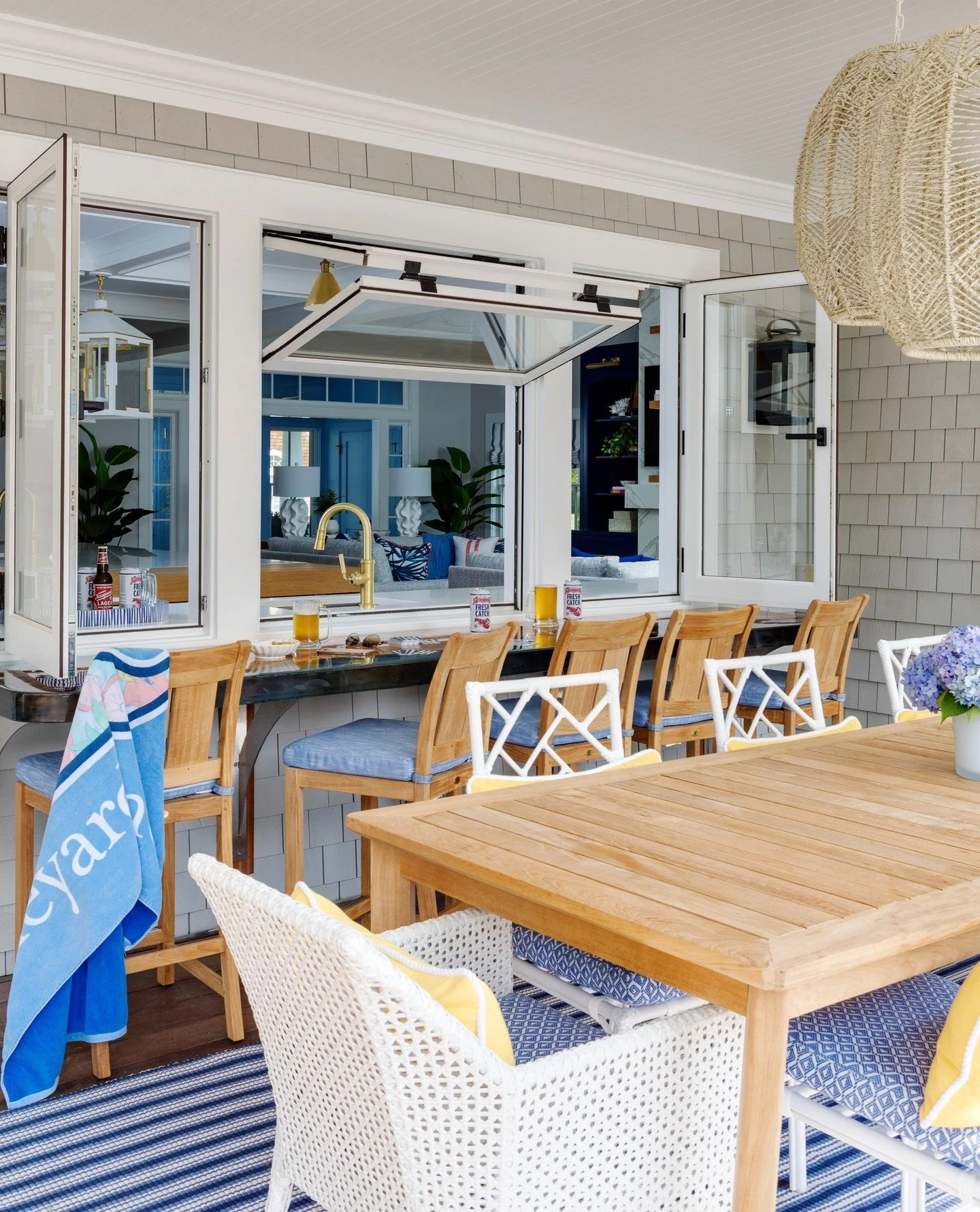 Blurring the line between indoors and out. ⁠In the kitchen at our Narragansett Pier Project, awning windows open directly to a live-edge bar on the porch, creating an easy connection between the two spaces and another place to gather. ⁠5⁠
⁠
A small a