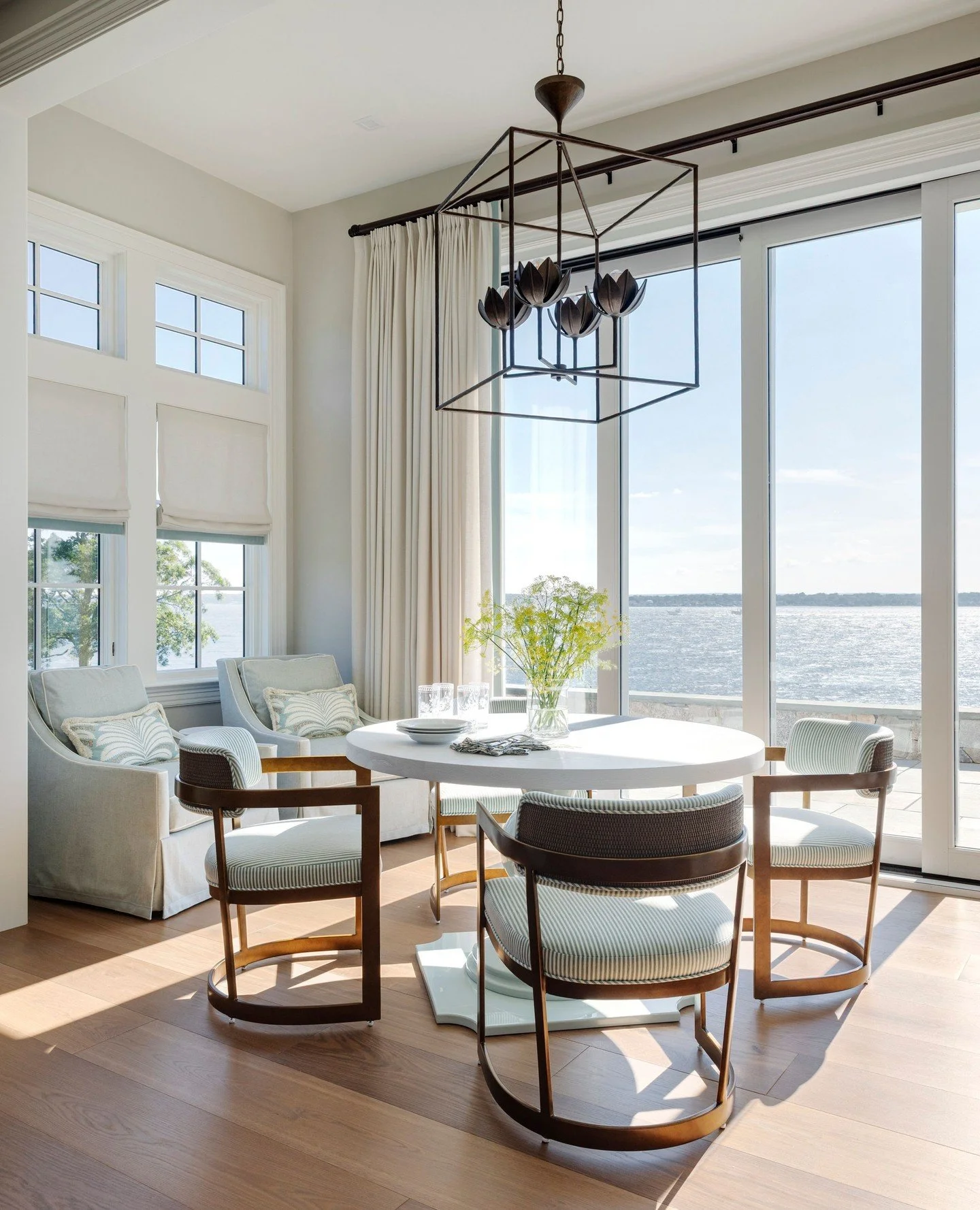 When the view is this good, the room knows its role. At our Bay View Project, an intimate dining nook pairs comfortable seating, warm wood tones, and plenty of natural light with an uninterrupted view of Narragansett Bay.⁠
⁠
Step inside the full Bay 