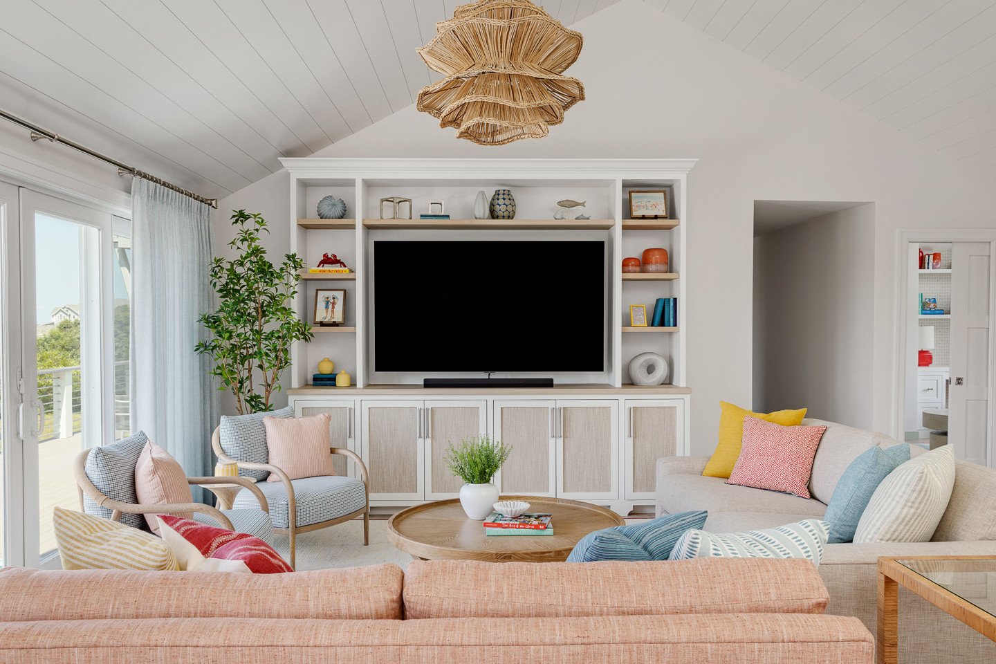 The living room of this Block Island home was designed to feel expansive without losing the sense of connection that defines the main level. Opening and vaulting the ceiling, then carrying the shiplap through the space, gave the room more height and 