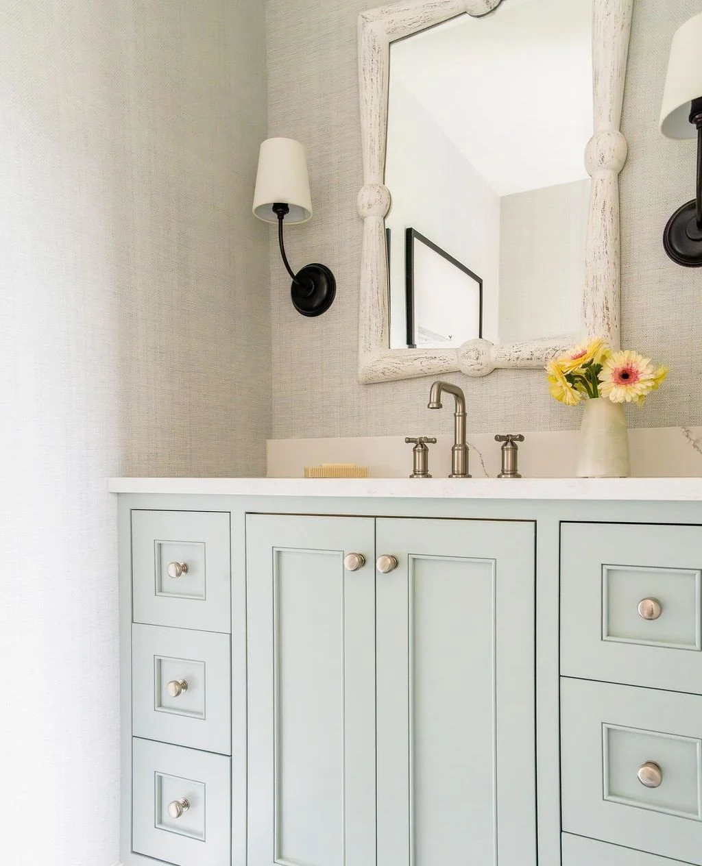 Located on the home&rsquo;s beach level, this powder room is part of a floor designed around easy transitions in and out of the house. We carried the blue-green palette and relaxed material story into the space so even its most practical moments stil