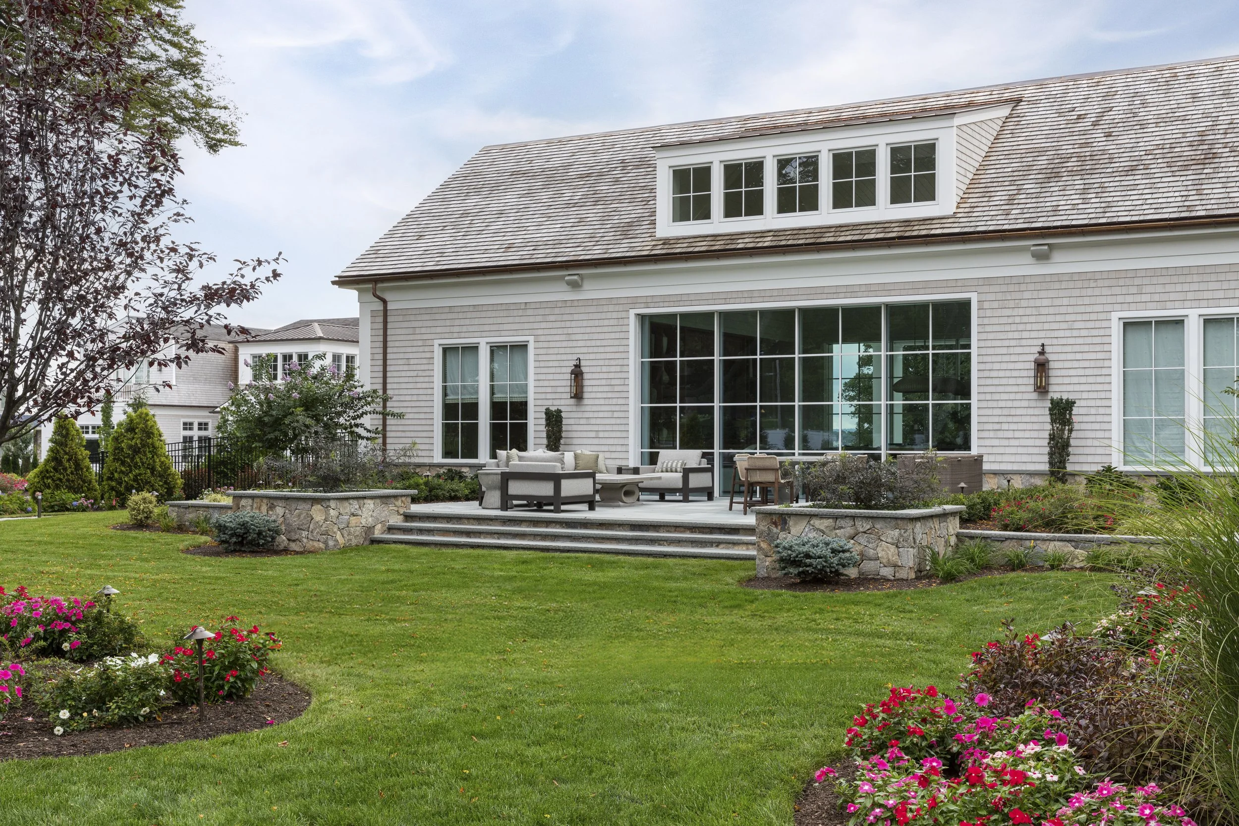 luxury-pool-house-exterior-landscaping-ri.jpg