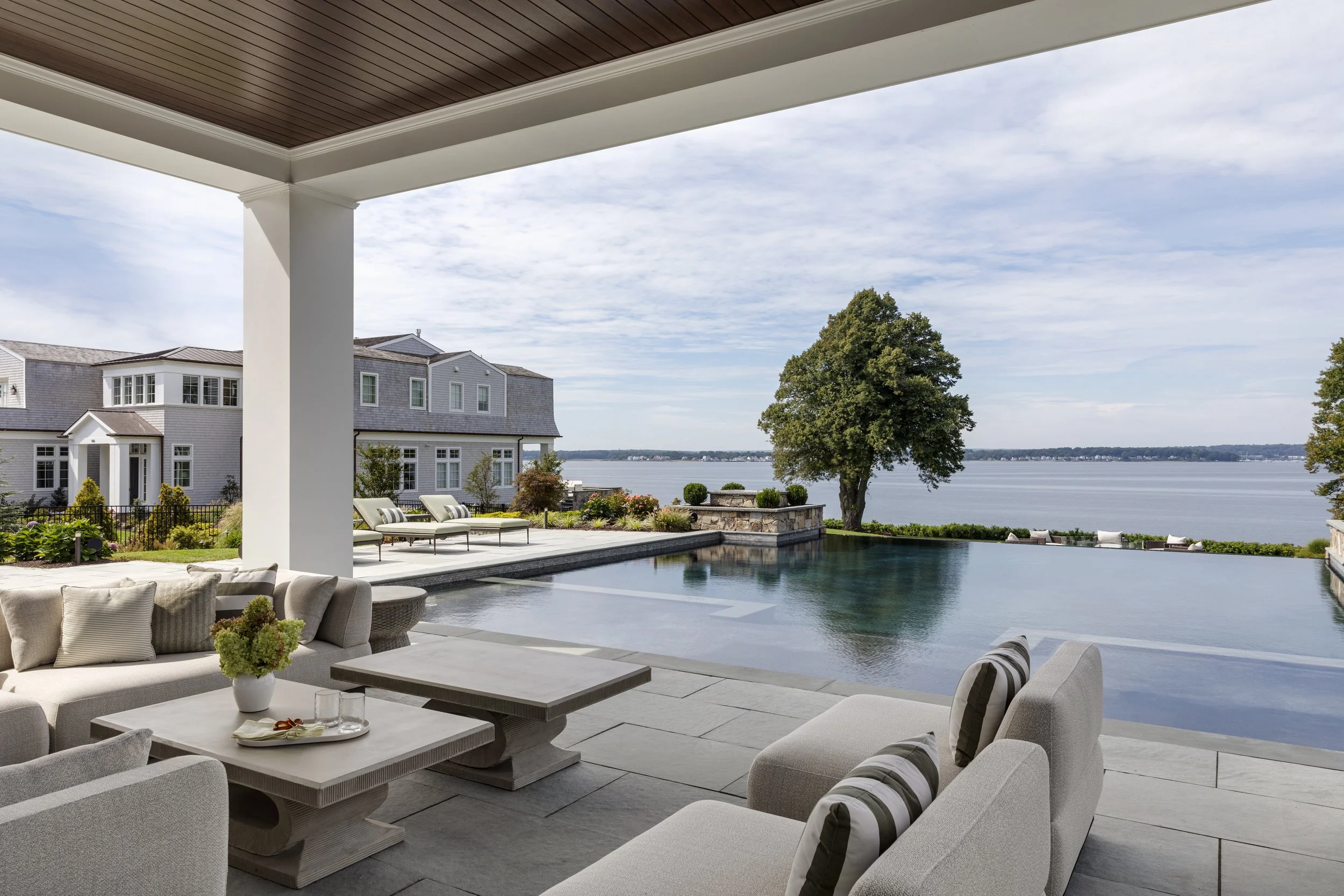 custom-pool-house-waterfront-patio-design.jpg
