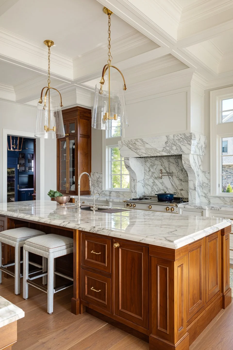 Kitchen with white marble counter tops and custom wood.jpg