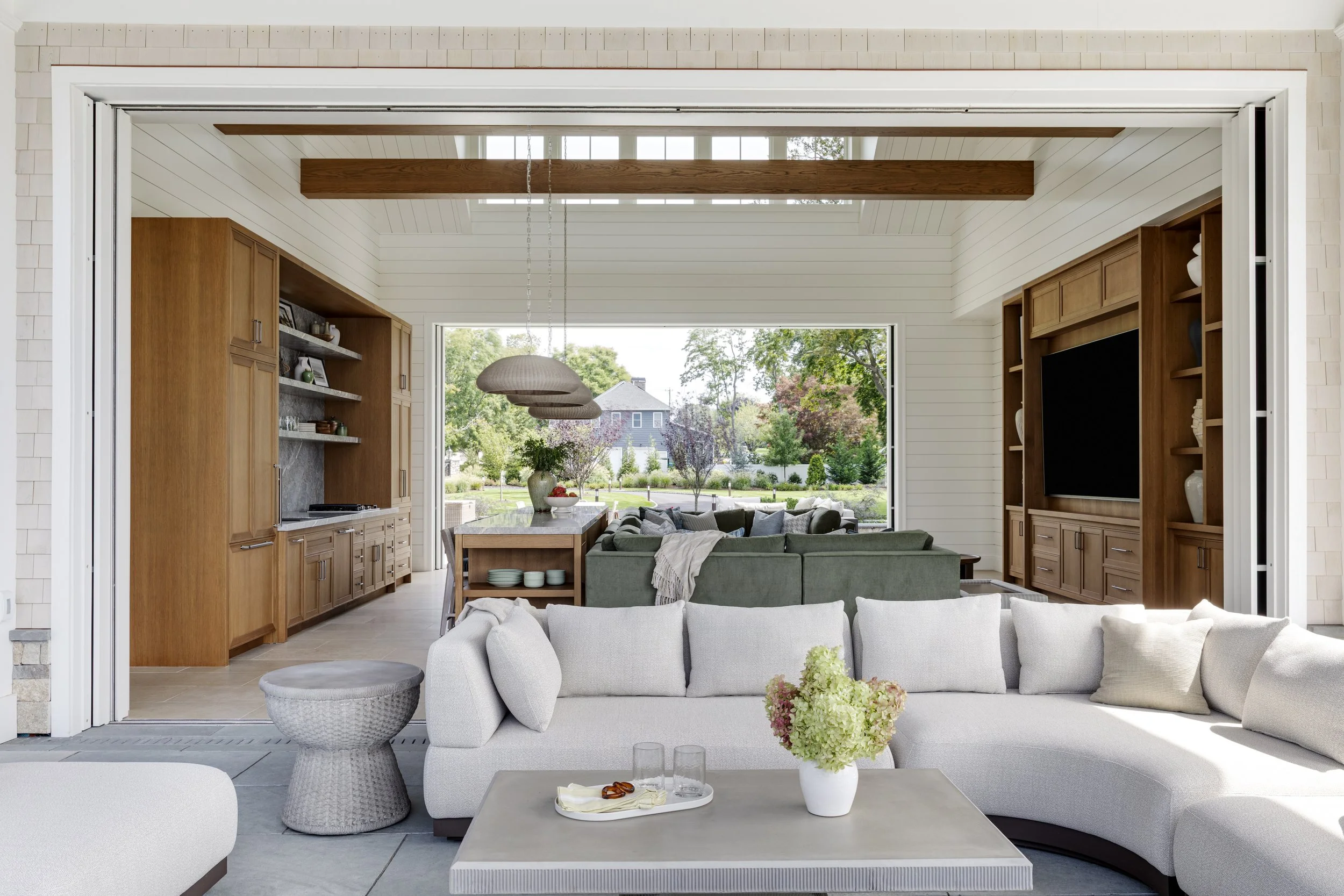 luxury-pool-house-living-room-custom-built-ins.jpg