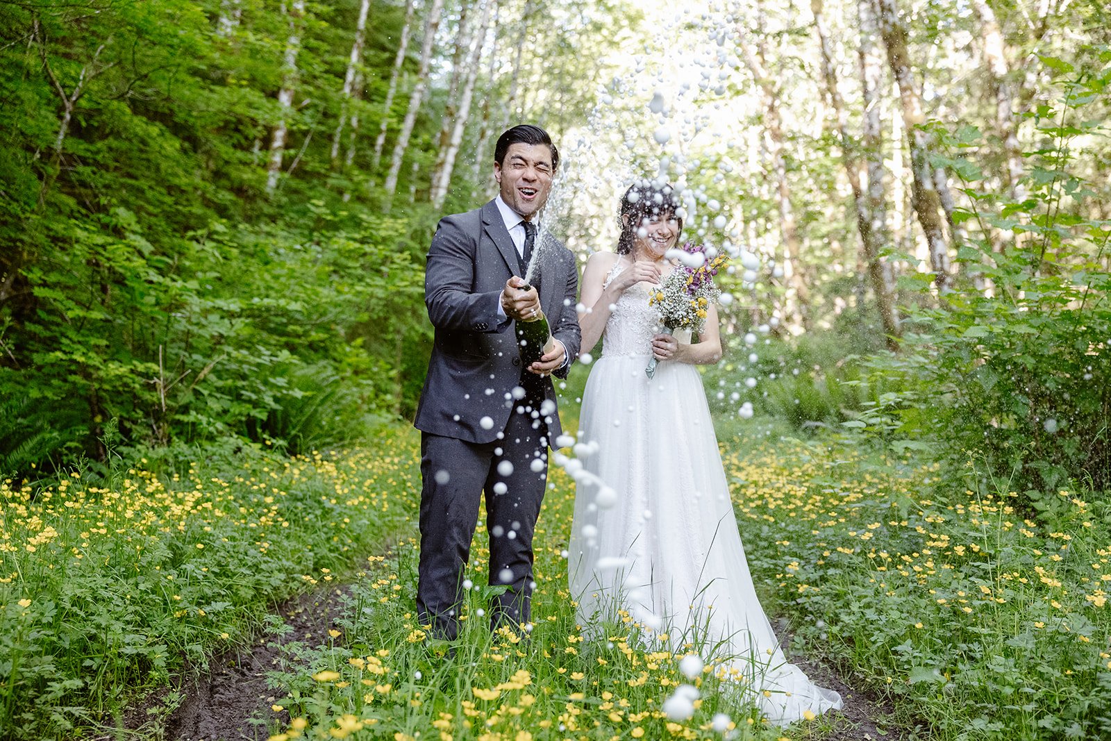 Washington couple shooting a champagne toast for their pacific northwest elopement