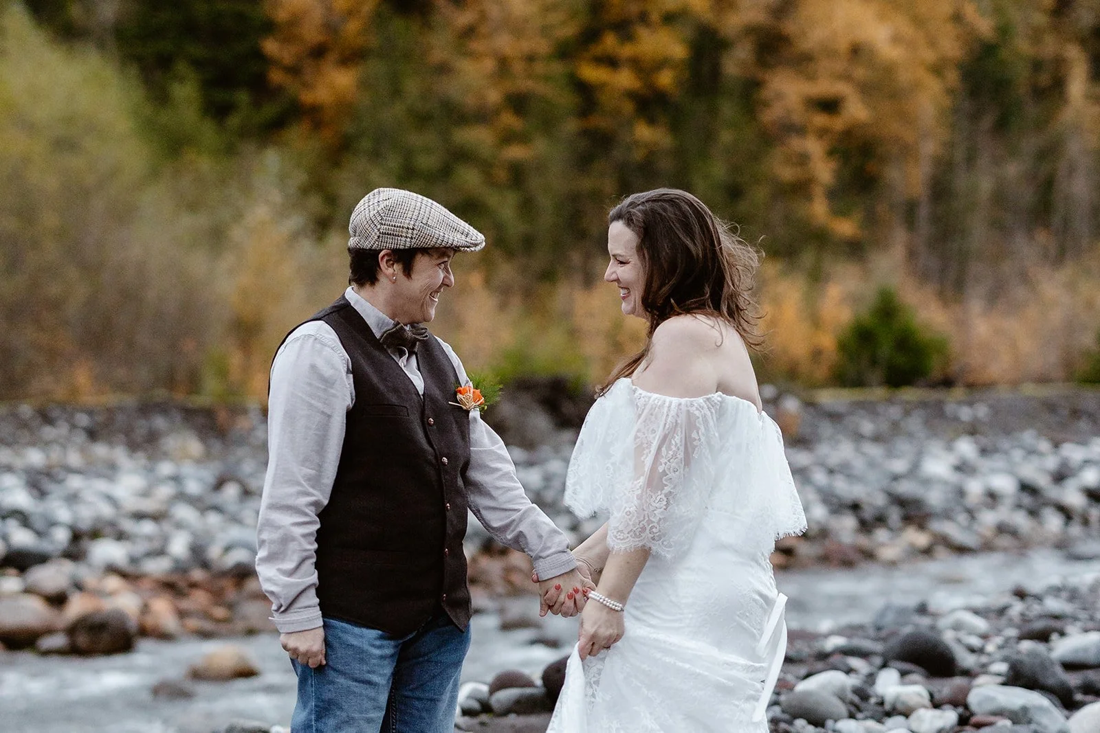 lgbtq couple smiling at each other for their rainy mount rainier elopement