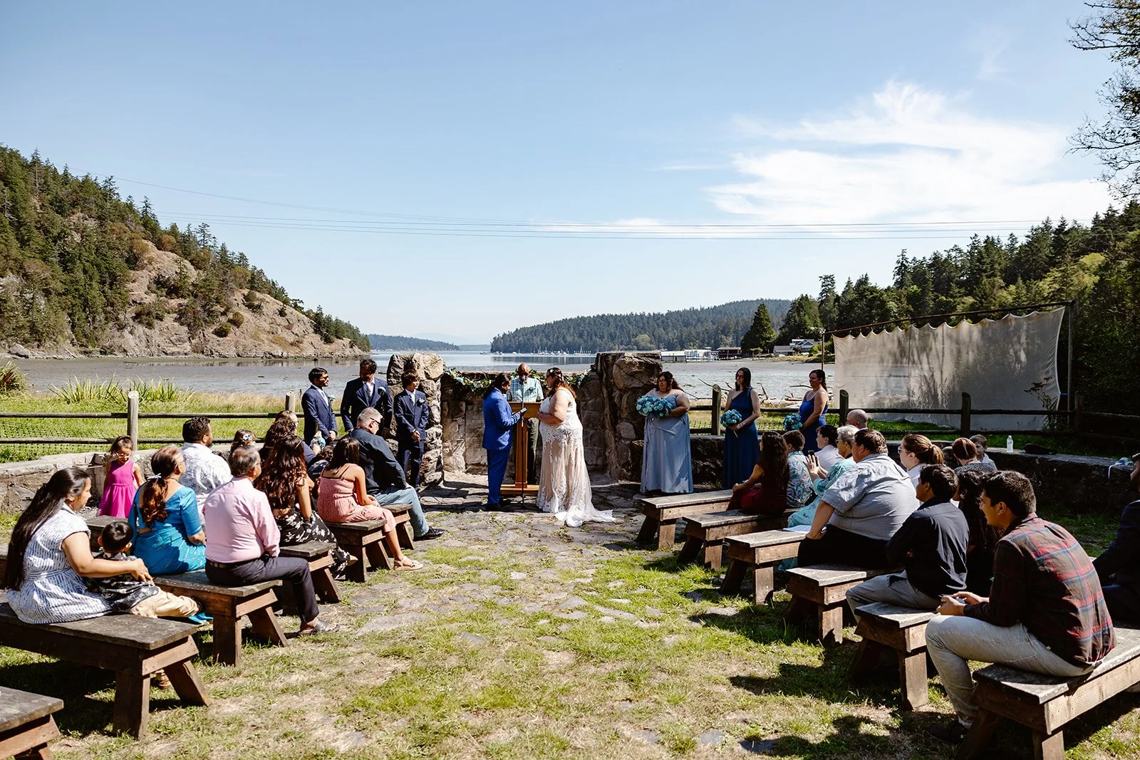 couple saying their vows at the ampitheather at corner bay retreat center
