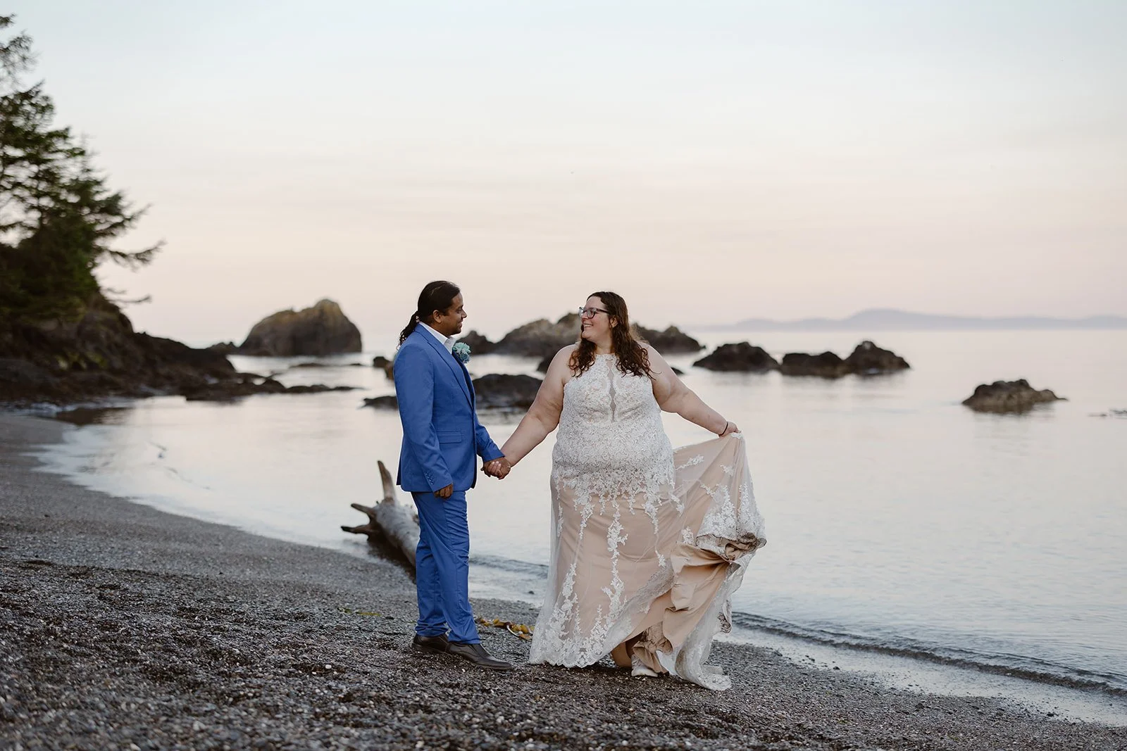 wedding couple dancing around deception pass during sunrise