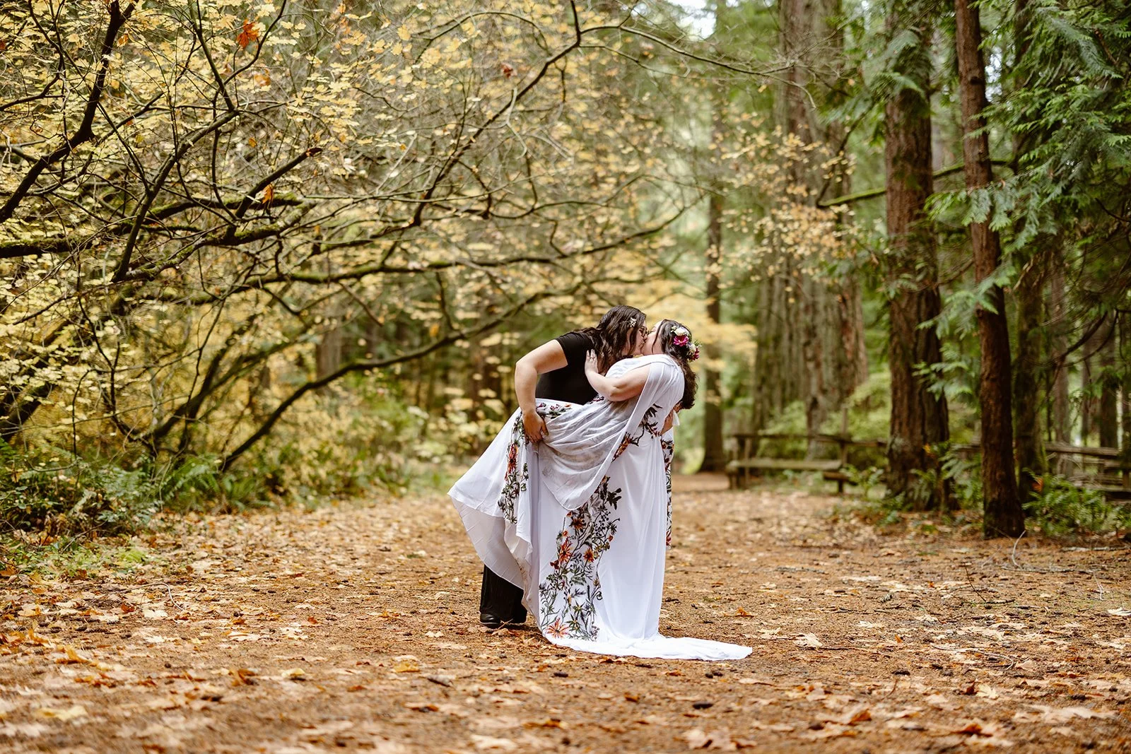 pnw elopement couple doing a dipping pose in the middle of the forest