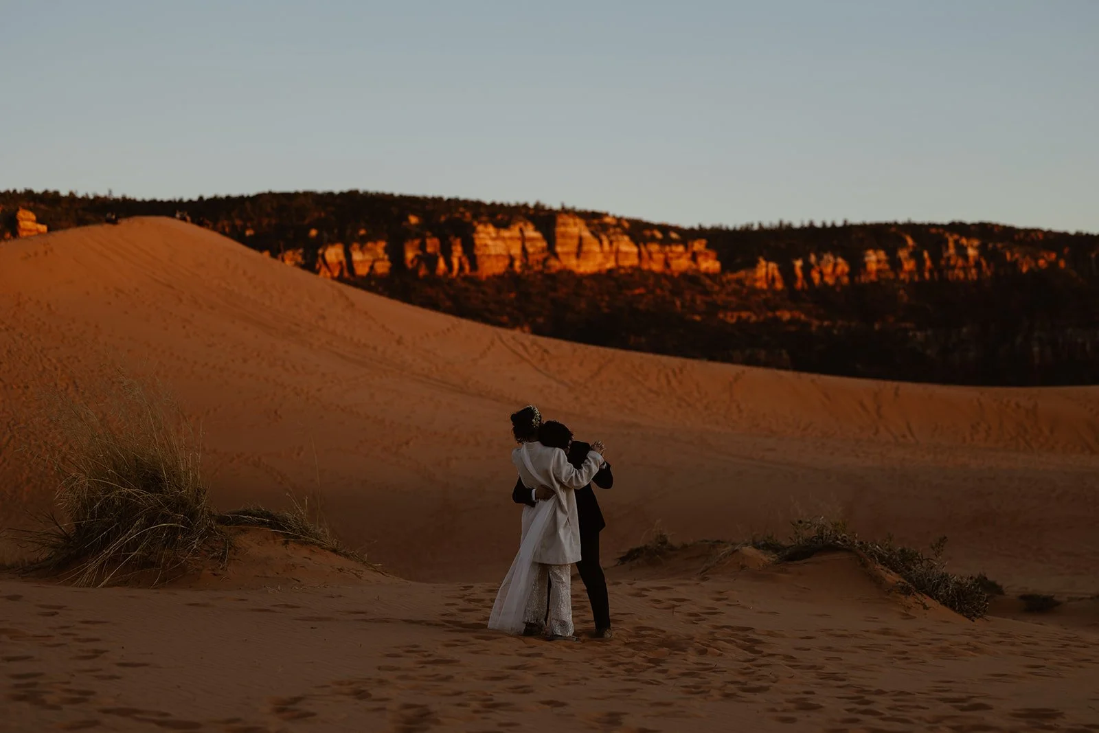 elopement couple in page arizona dancing during sunset