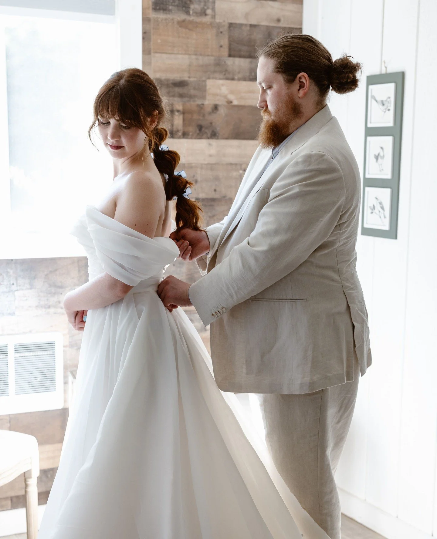 While getting ready separately and doing a first look is somewhat of a wedding tradition at this point, there is something to be said for the intimacy of getting ready together.⁠
⁠
If the dress isn&rsquo;t a secret, consider helping each other get re